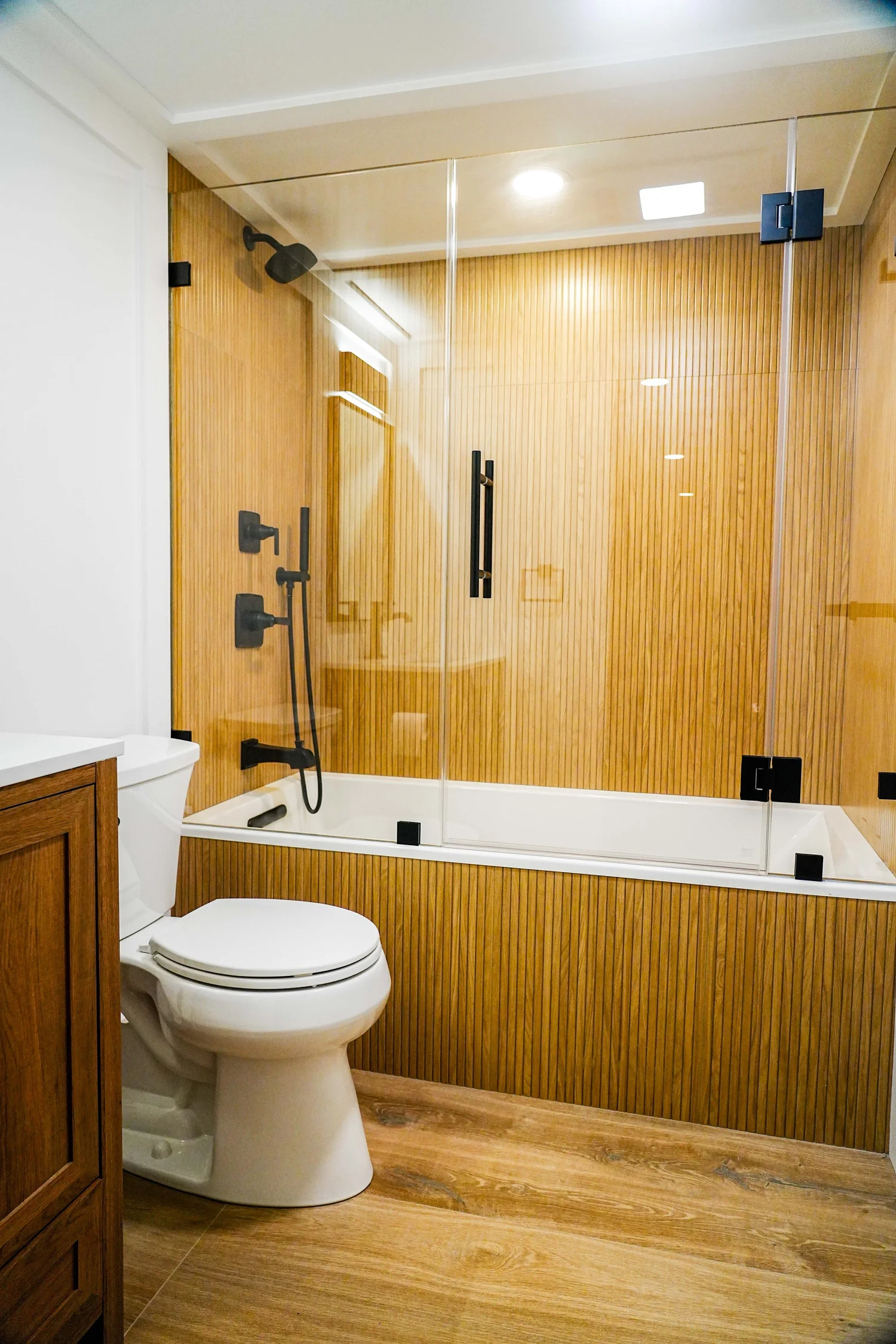 Wood-Tone Bathroom & Glass Shower