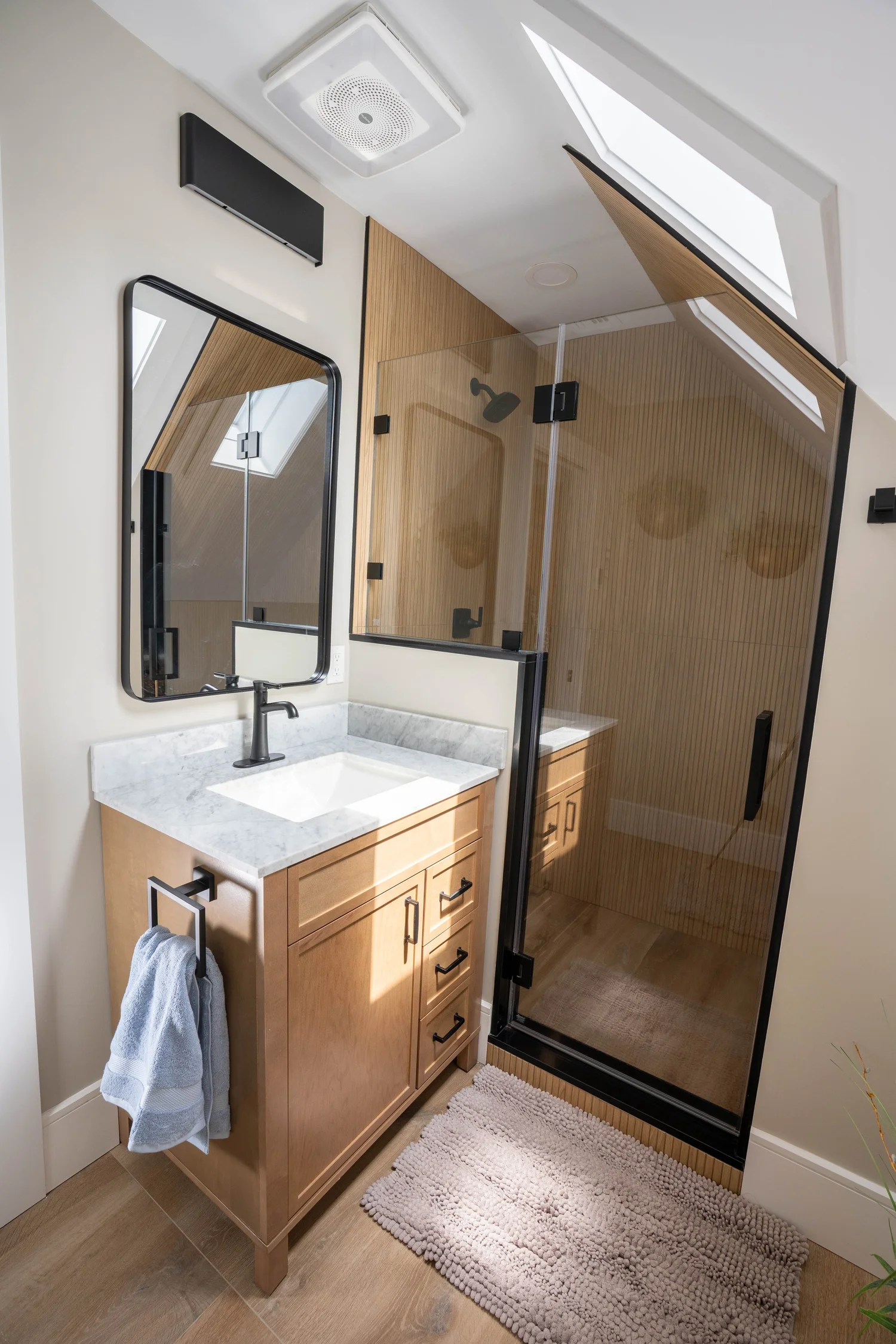 Wood-Tone Shower & Skylight