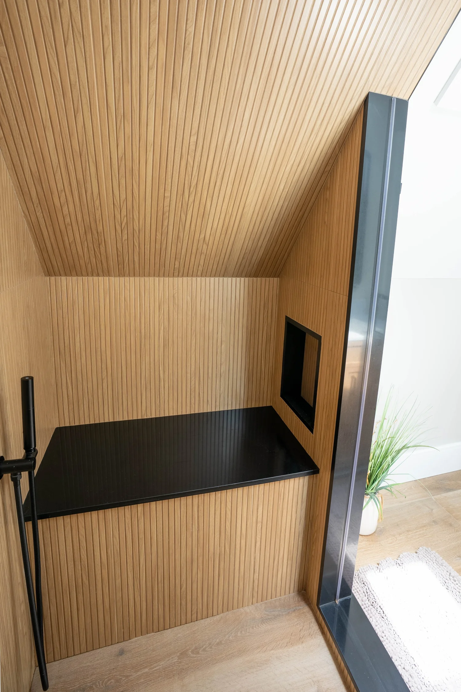 Wood-Tone Shower & Skylight — photograph 2