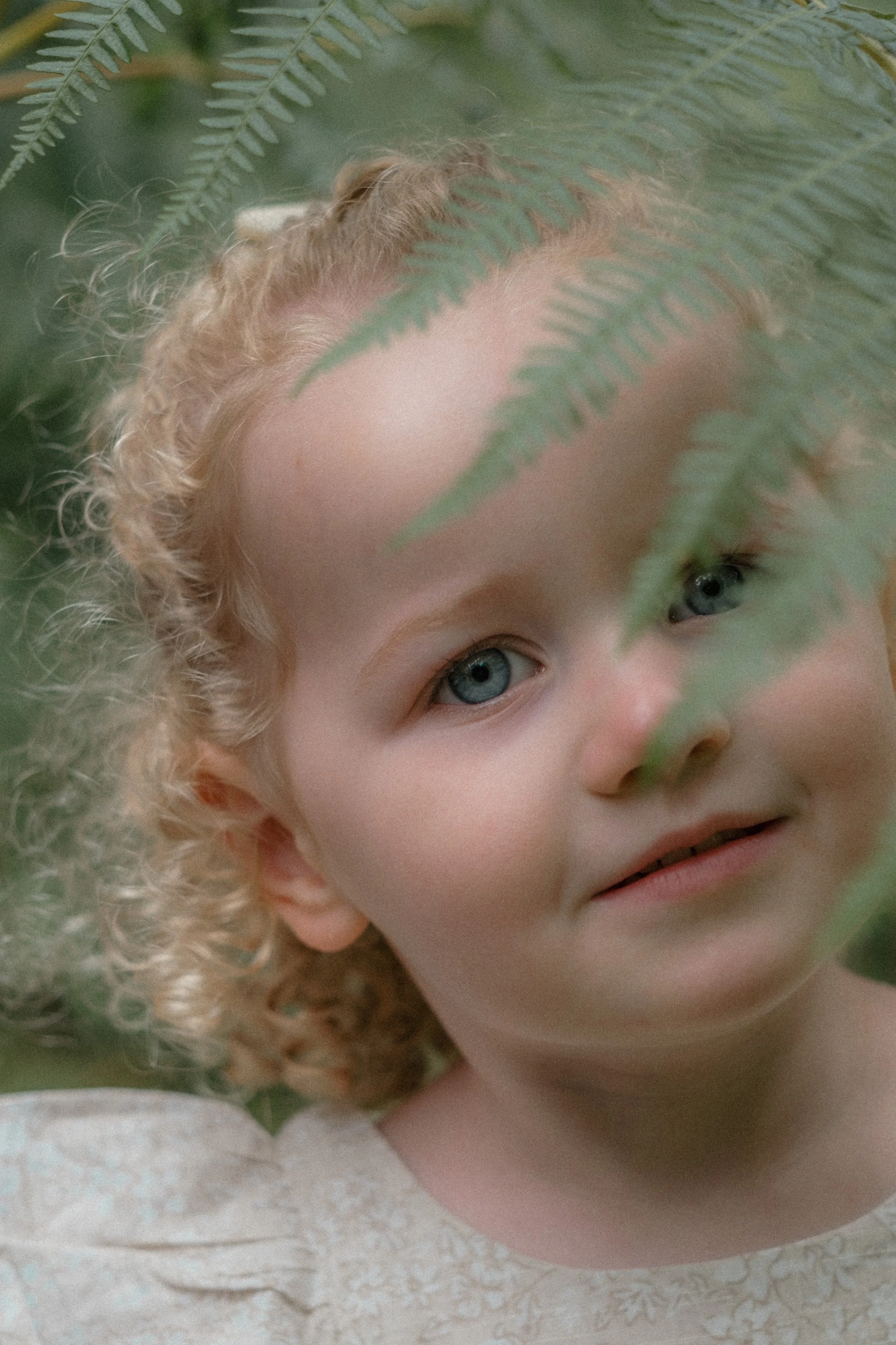 A portrait of a child taken during an outdoor family photoshoot near Ross on Wye, Herefordshire 
