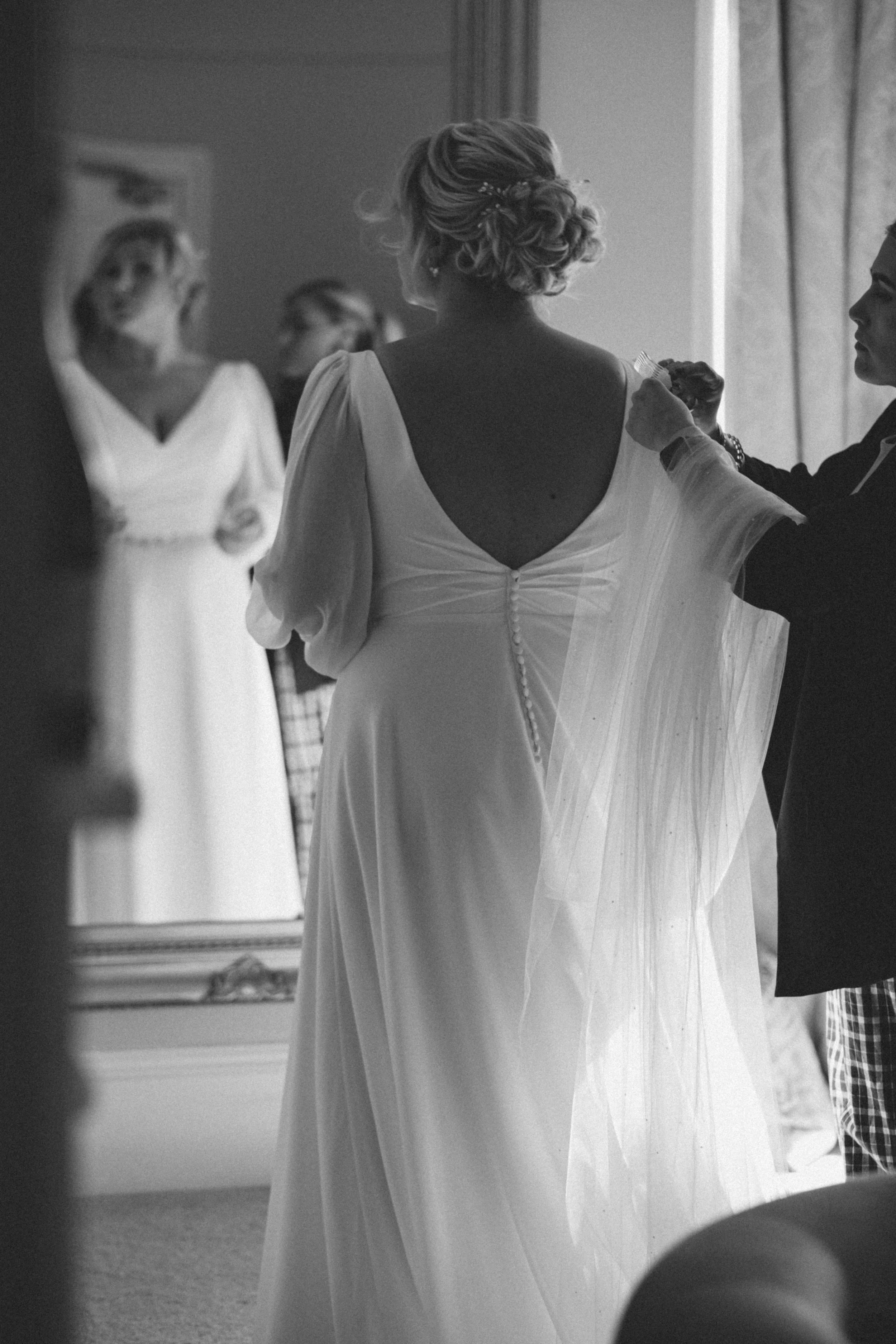 Natural getting ready photo during a wedding at Glewstone court, Ross on wye 