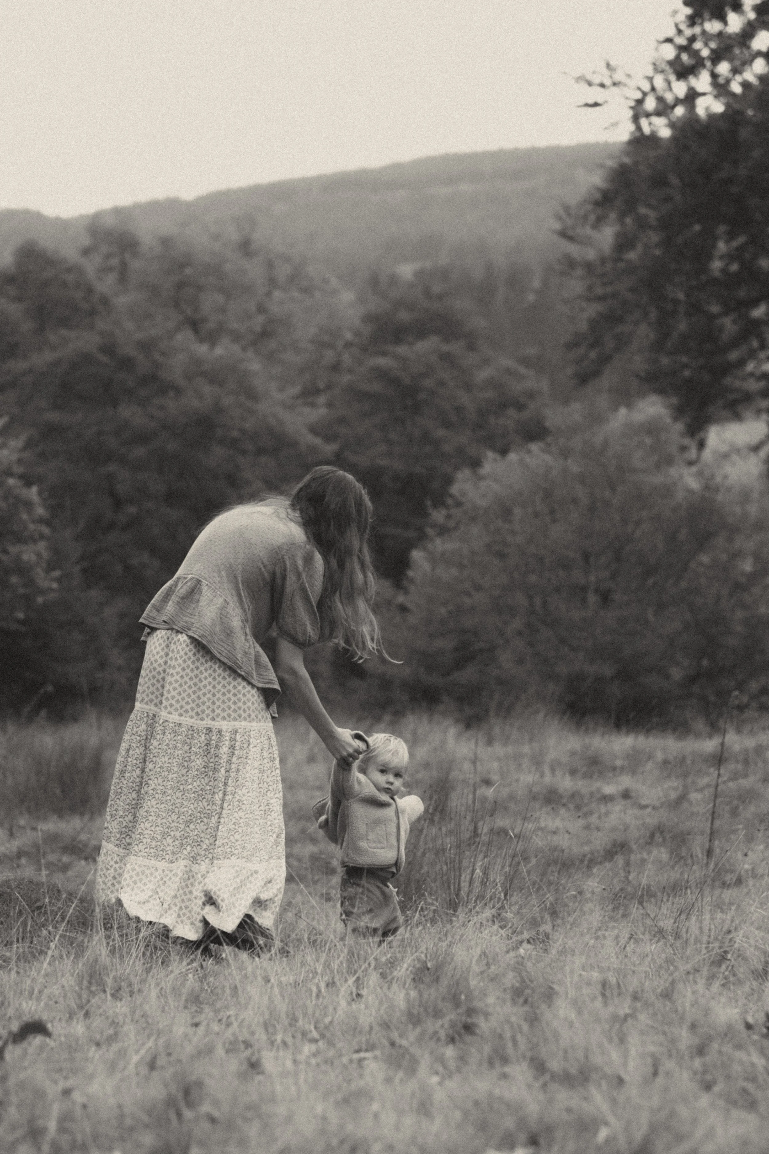 Mother and toddler during a relaxed, natural motherhood outdoor photoshoot in Wales