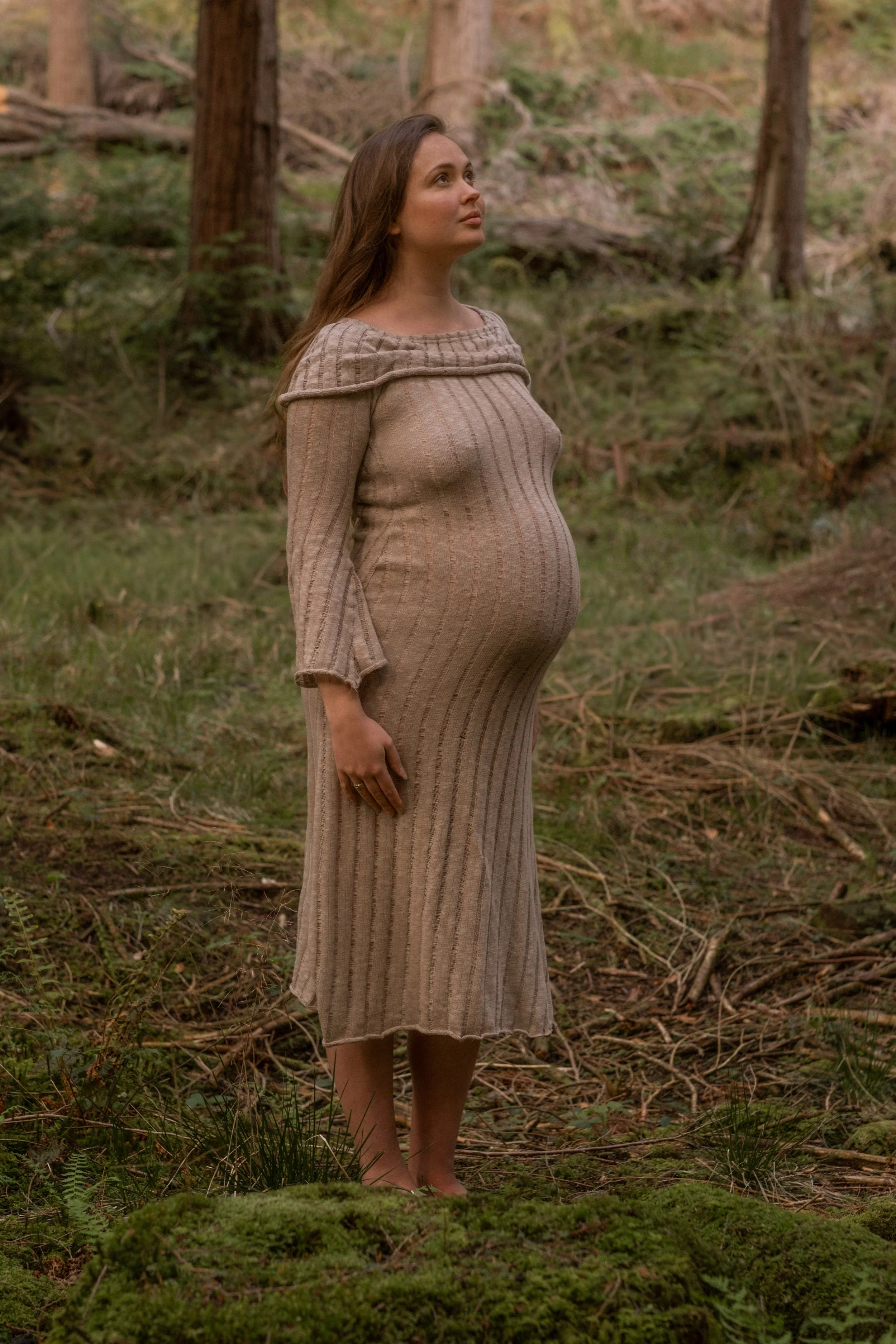 Mother in a forest during a relaxed, natural motherhood maternity outdoor photoshoot in Wales