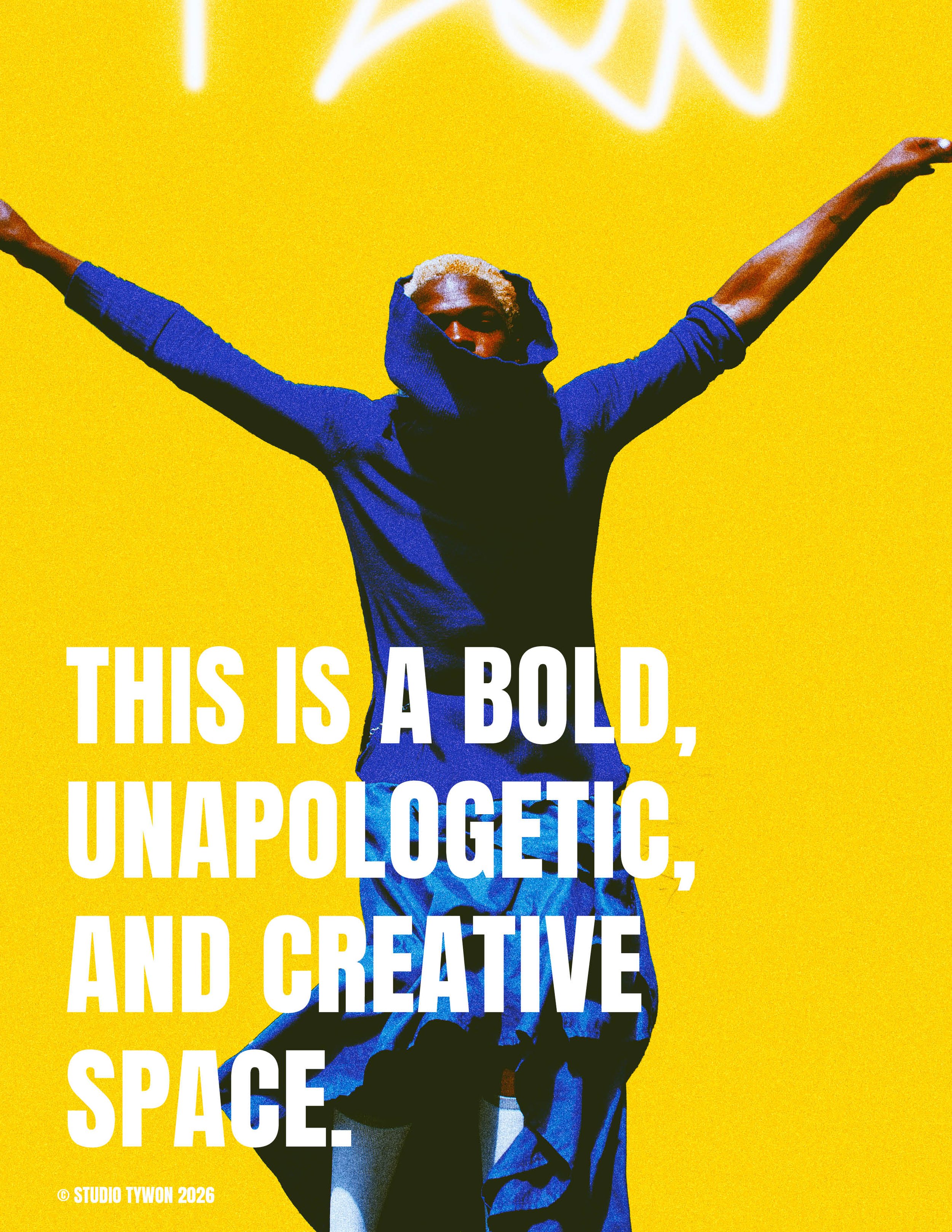 A person with blonde hair wearing a dark hooded shirt, standing with arms spread wide against a bright yellow background with white neon text at the top. Text overlay reads: "This is a bold, unapologetic, and creative space."