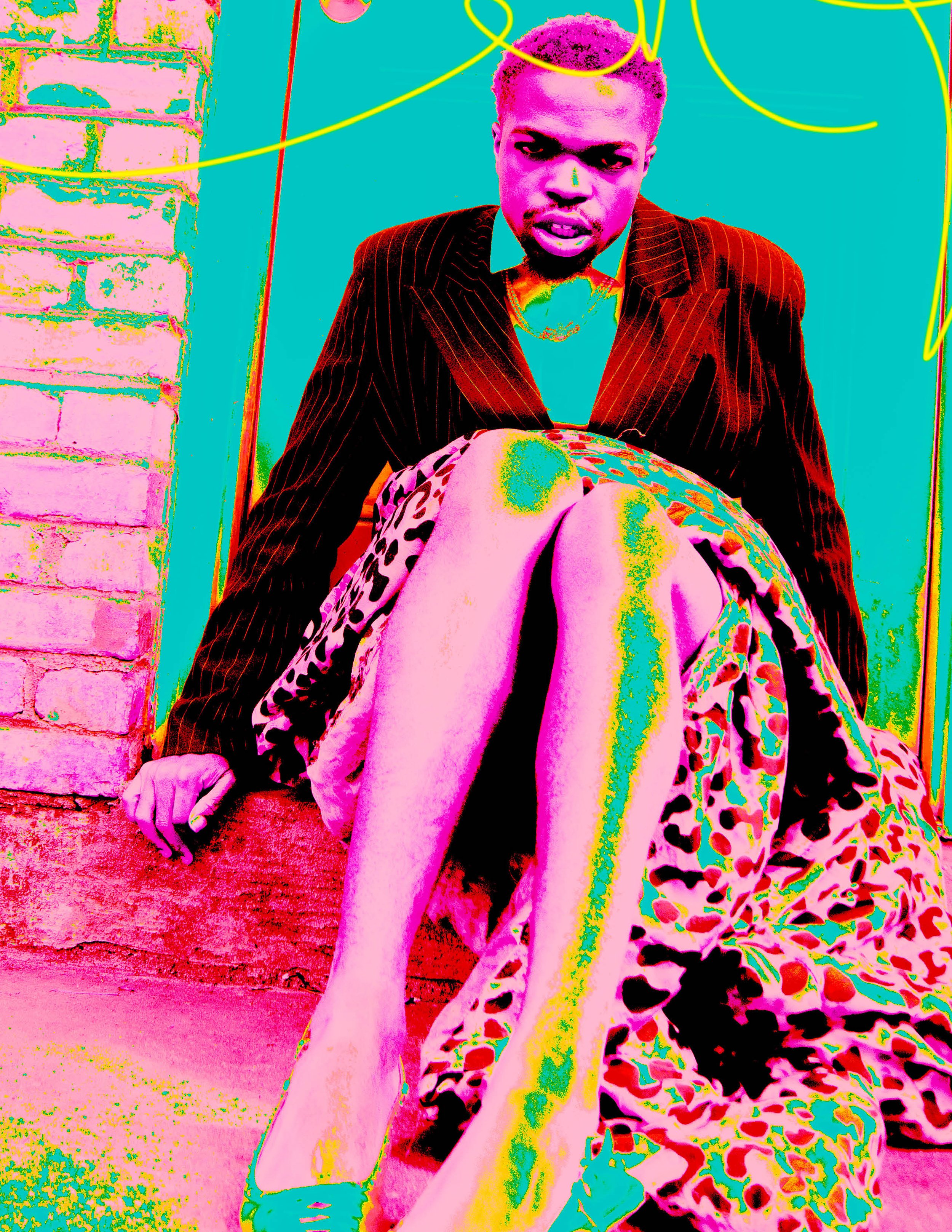 A digitally edited photo of a person sitting against a brick wall, wearing a pinstripe blazer and a colorful leopard print dress, with vivid and exaggerated color effects.