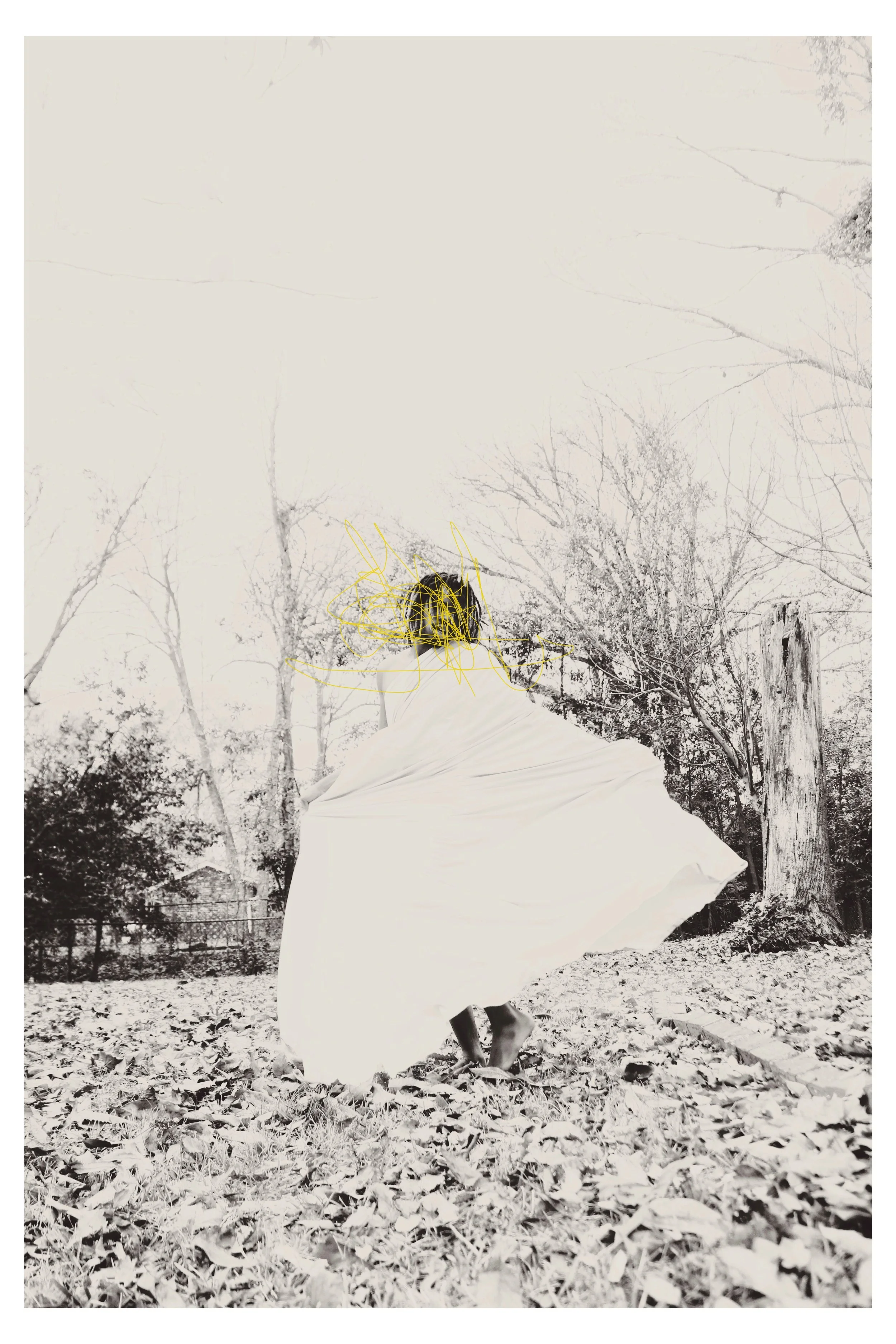 A person wearing a white dress and a black head covering is spinning outdoors, surrounded by trees and fallen leaves, with bare branches and wooden tree stumps visible in the background.