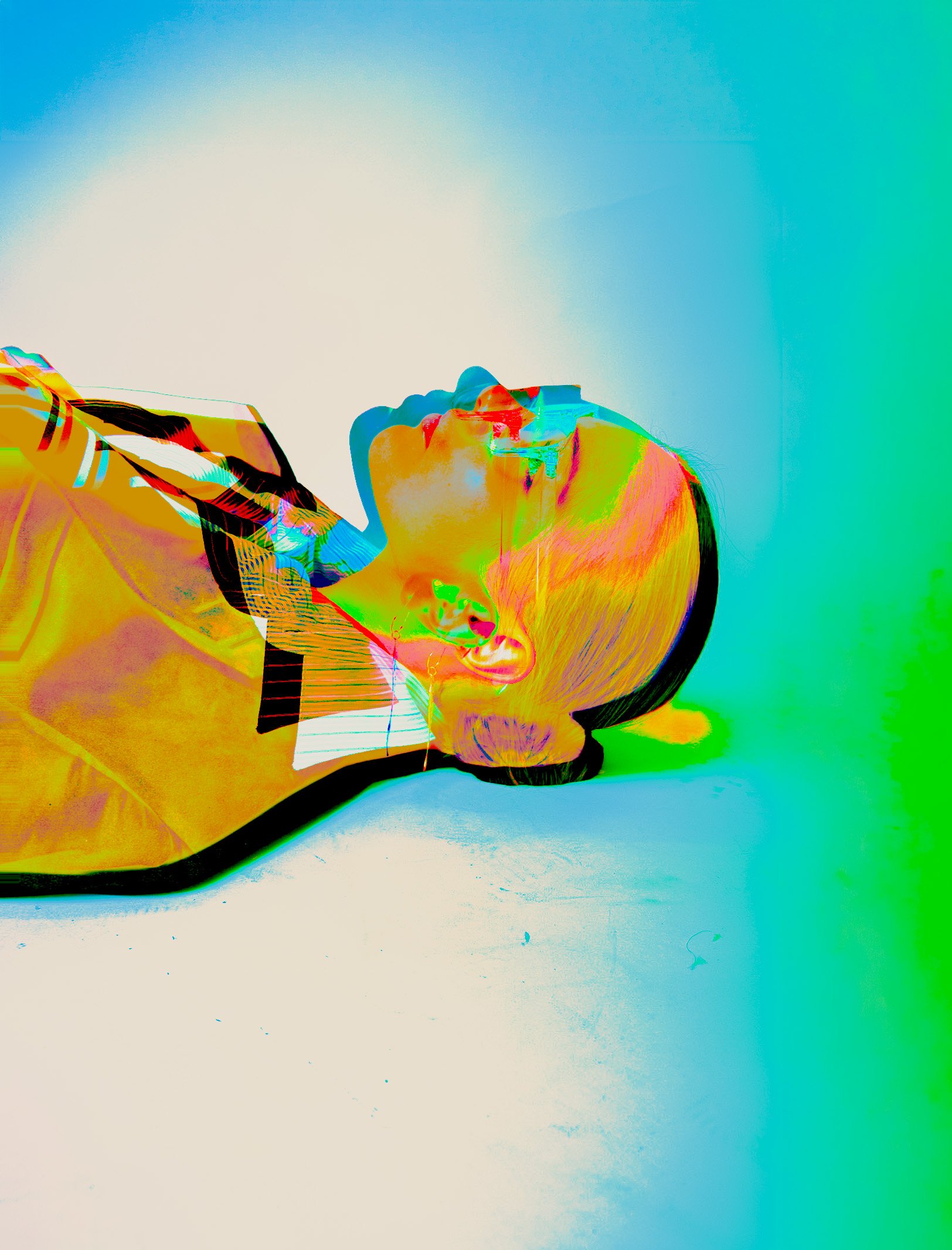 Abstract digital artwork with a central profile of a person, blending vibrant colors like yellow, orange, red, green, blue, and cyan, set against a gradient background.