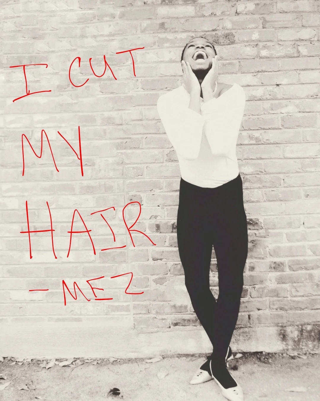 A man standing against a brick wall, smiling with her hands on her face. Text in red handwritten style says 'I CUT MY HAIR - MEZ'.