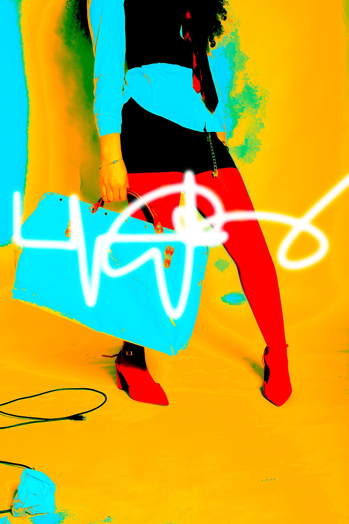 A person holding a large blue handbag, wearing red high-heeled shoes, a black skirt, and a blue top, with a colorful background and a neon sign that appears to spell 'LAD'.