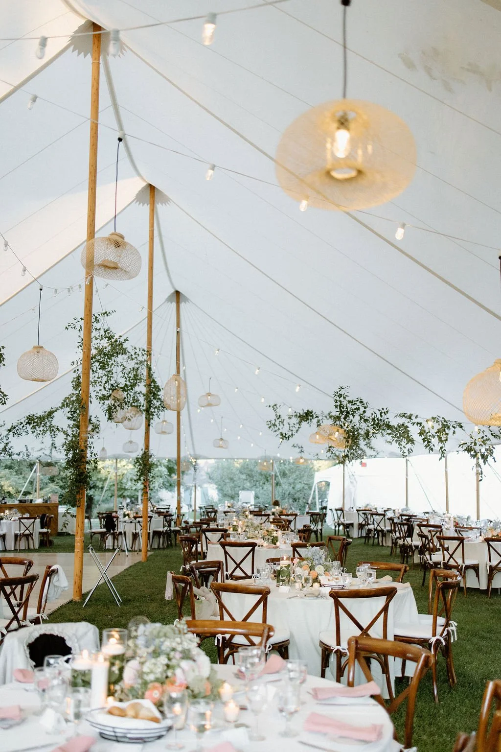 Decorated baby and puppy cookies on a cooling rack, including cookies with the words "baby," "girl," and "you," as well as bows, a baby stroller, and a puppy illustration.