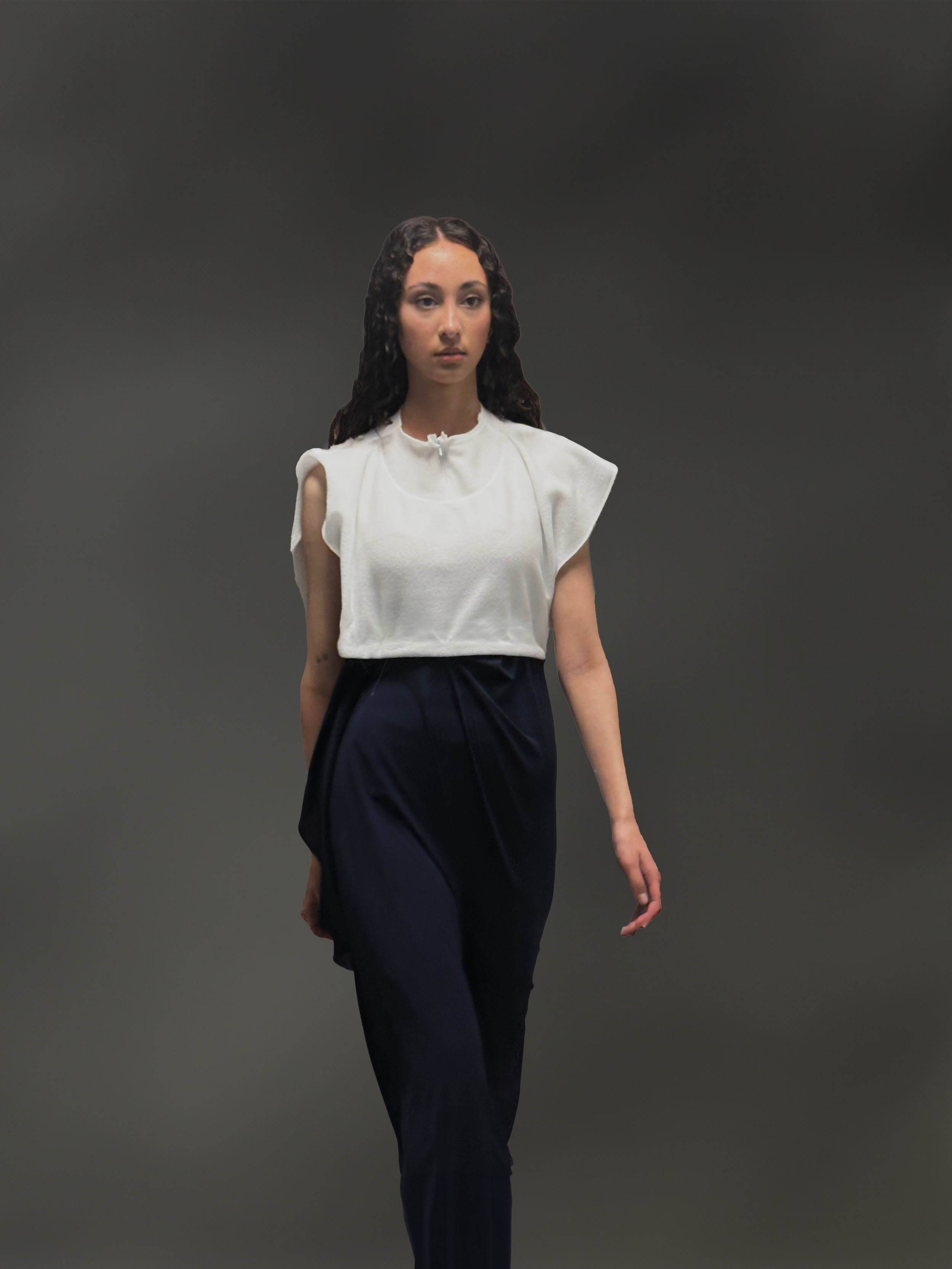 white sleeveless top and navy blue skirt