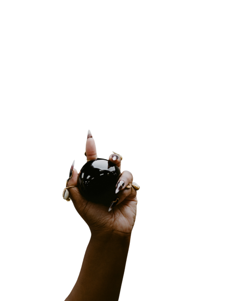 Samar's hand reaching up, holding a black crystal ball.