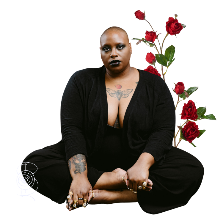 Samar sitting cross legged with roses behind them.