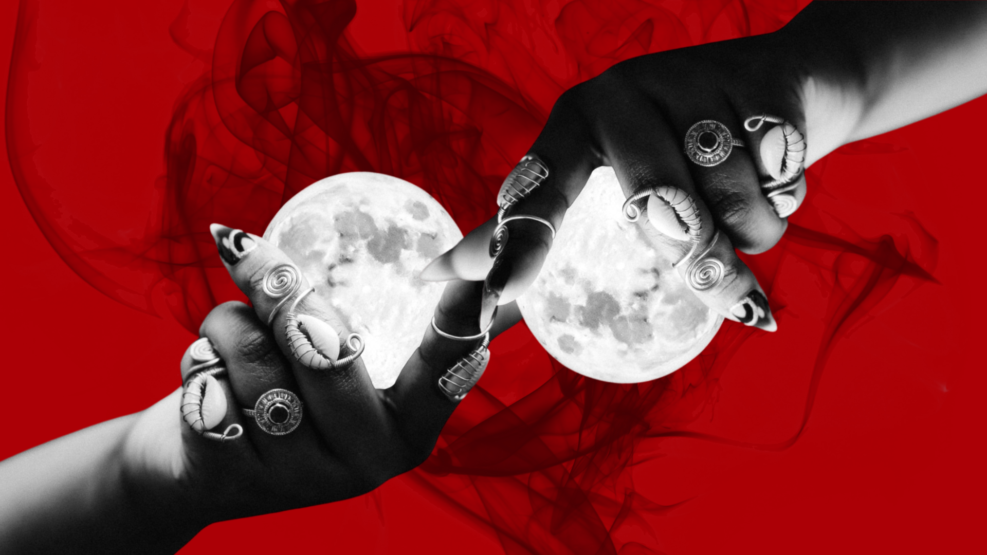 Two hands holding the moon, with red background and abstract smoke patterns, decorated with rings and jewelry.