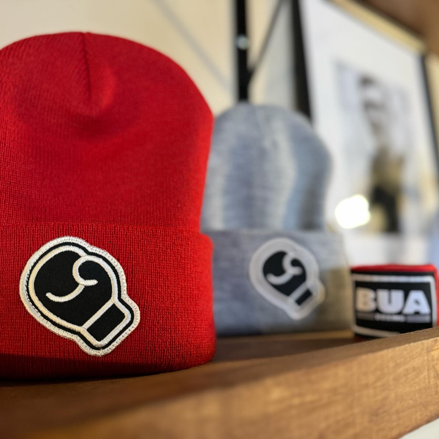 Beanies, hand wraps, boxing gloves, sweatshirts, and more are available on our website [buaboxing.com/shop]
