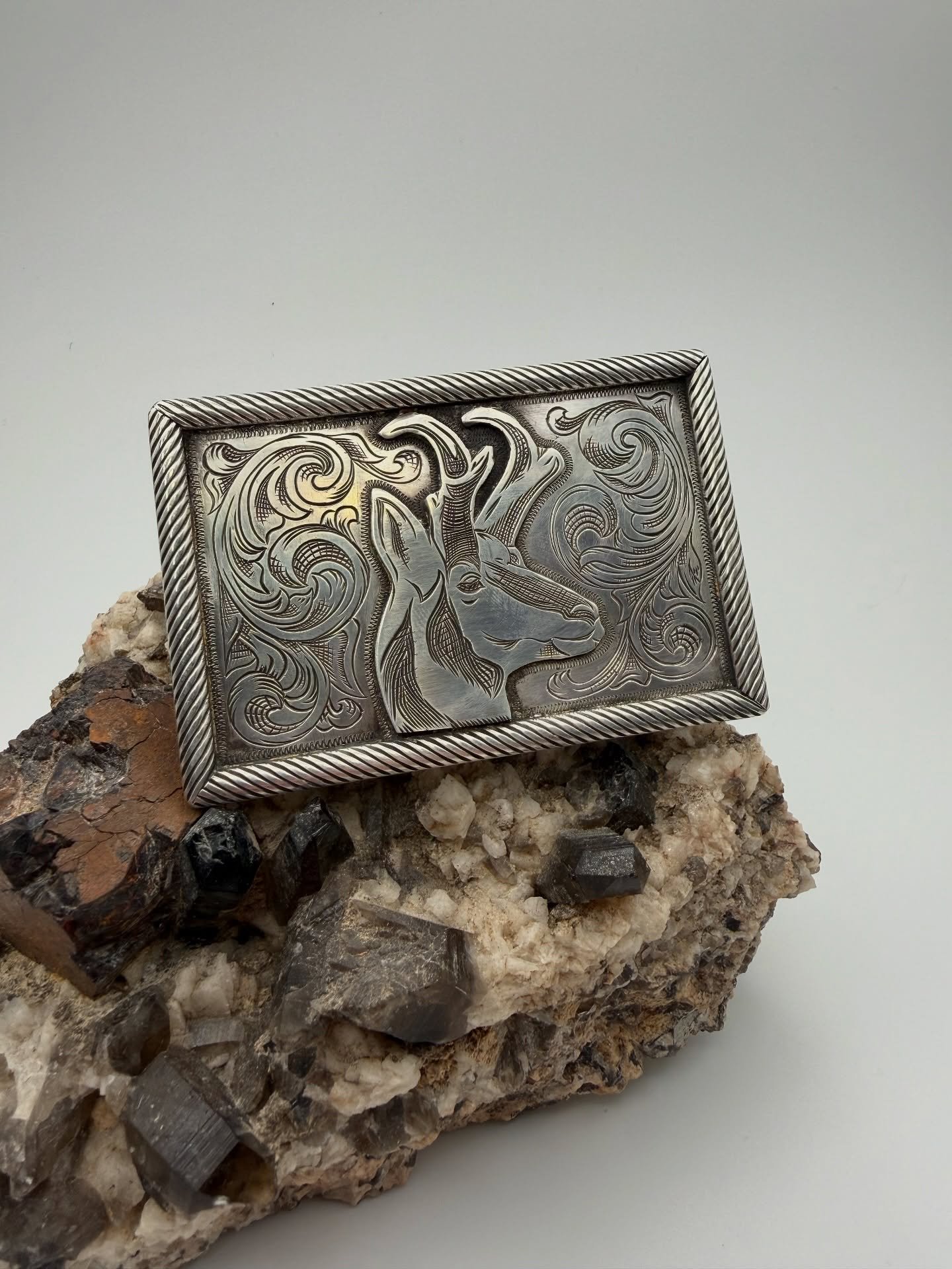 Solid sterling silver trophy buckle. Built from scratch and hand engraved. Thanks @ambrosegray for the soldering assist! One of the last projects of the year coming out of the shop. #handengraving #silver #silversmith #beltbuckle #western #westernart