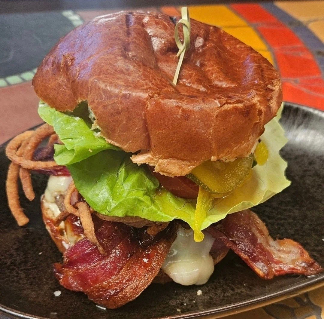 It's burger Tuesday! Saddle up for The Western burger, made with Hearst Ranch 100% grass fed patty, crispy onion straws, white cheddar, aioli, on a brioche bun.