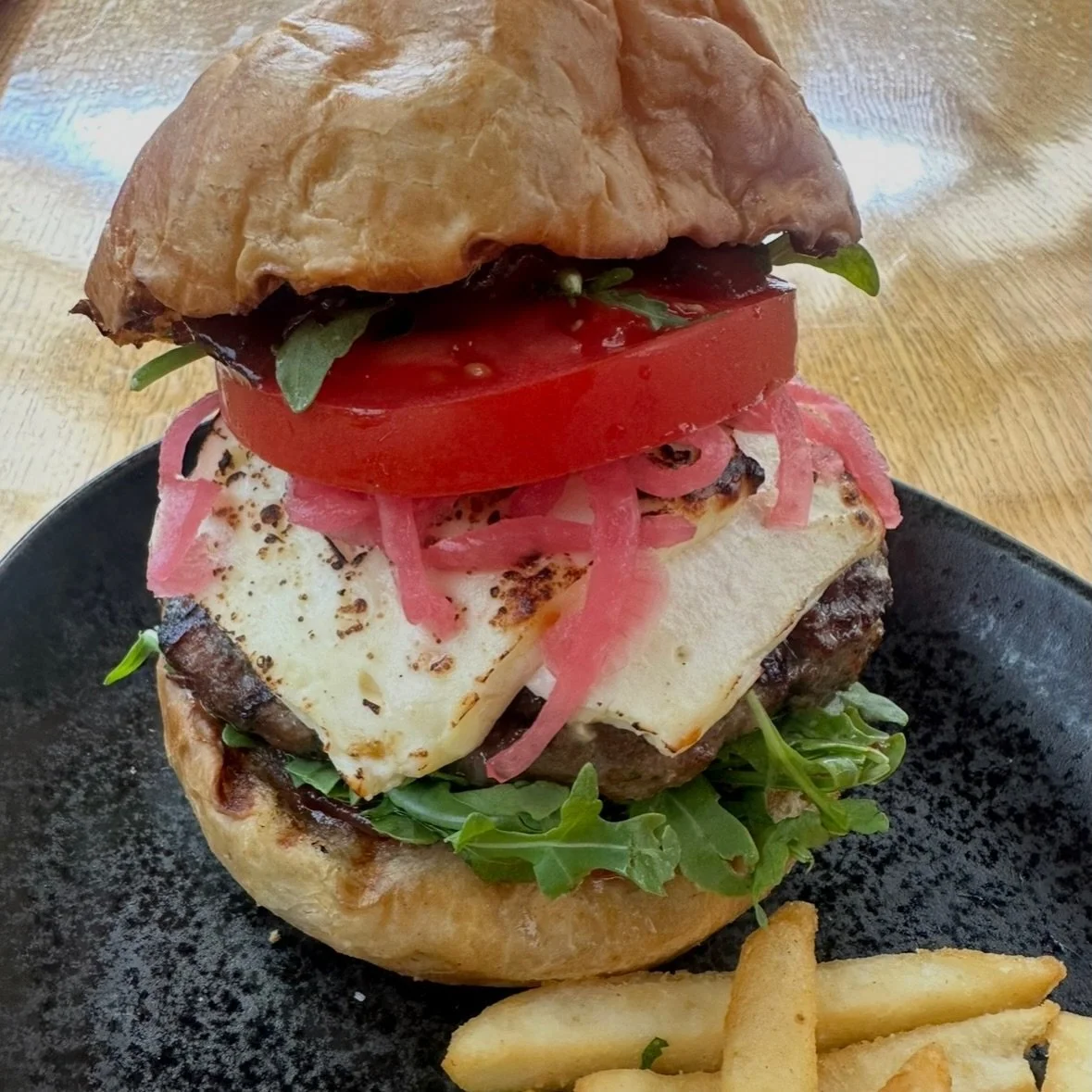 Tonight we'll be serving a BBQ local pork burger (not pictured) made with house-made bread &amp; butter pickles, white cheddar, and coleslaw. 🍔