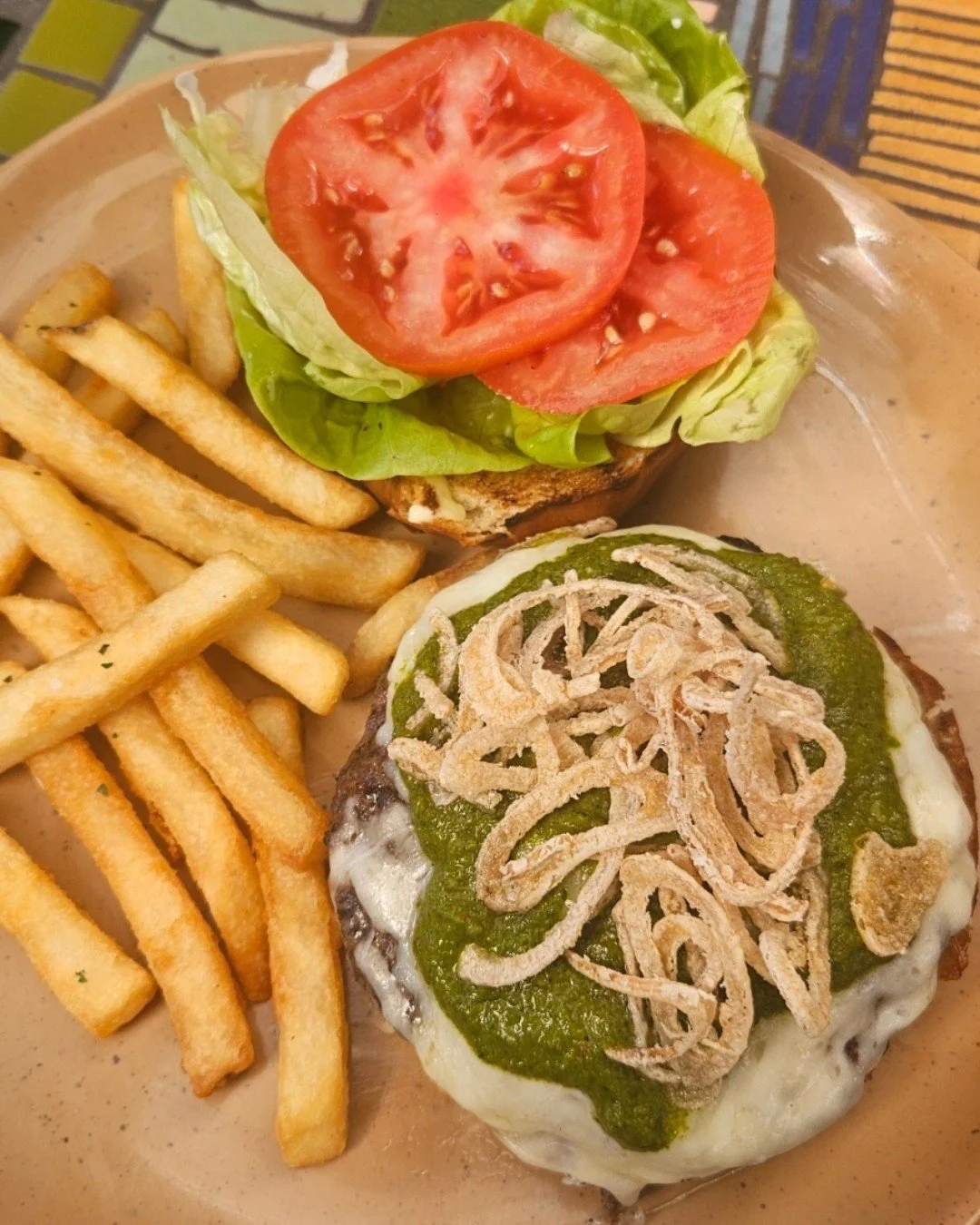 Tomorrow night is Burger Tuesday! Join us for dinner and enjoy our Chimichurri Burger: Hearst Ranch grass-fed beef, melted white cheddar, fresh greens, and crispy onion straws, finished with chimichurri and aioli on a buttery brioche bun. The perfect