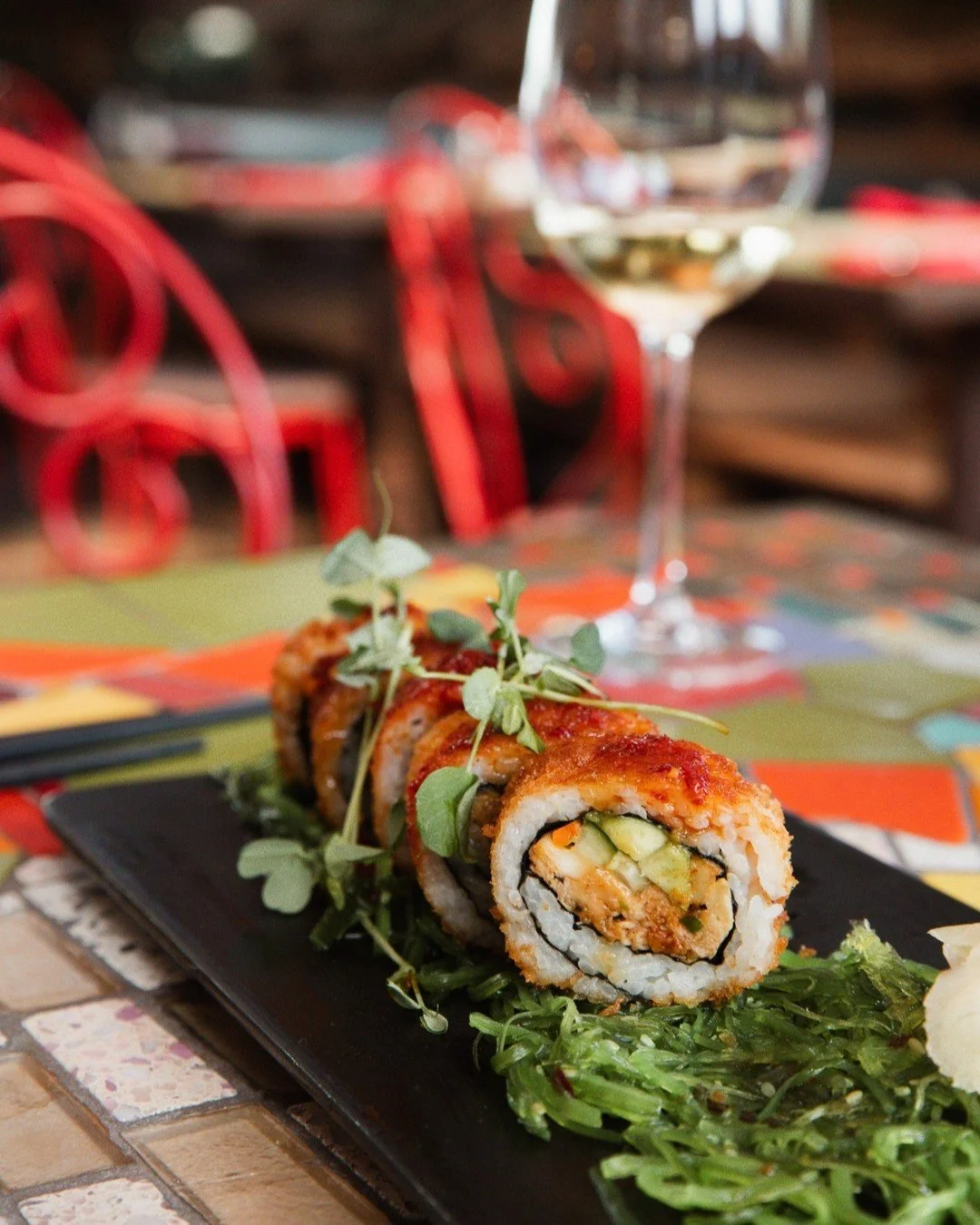 It's Sushi Roll Friday! Join us for dinner and enjoy our specialty Salmon Roll: Skuna Bay Salmon, avocado, cucumber, jalapeno, ponzu sauce, bonito flakes, wrapped in nori and sticky rice and topped with garlic aioli, served with fried garlic, seaweed
