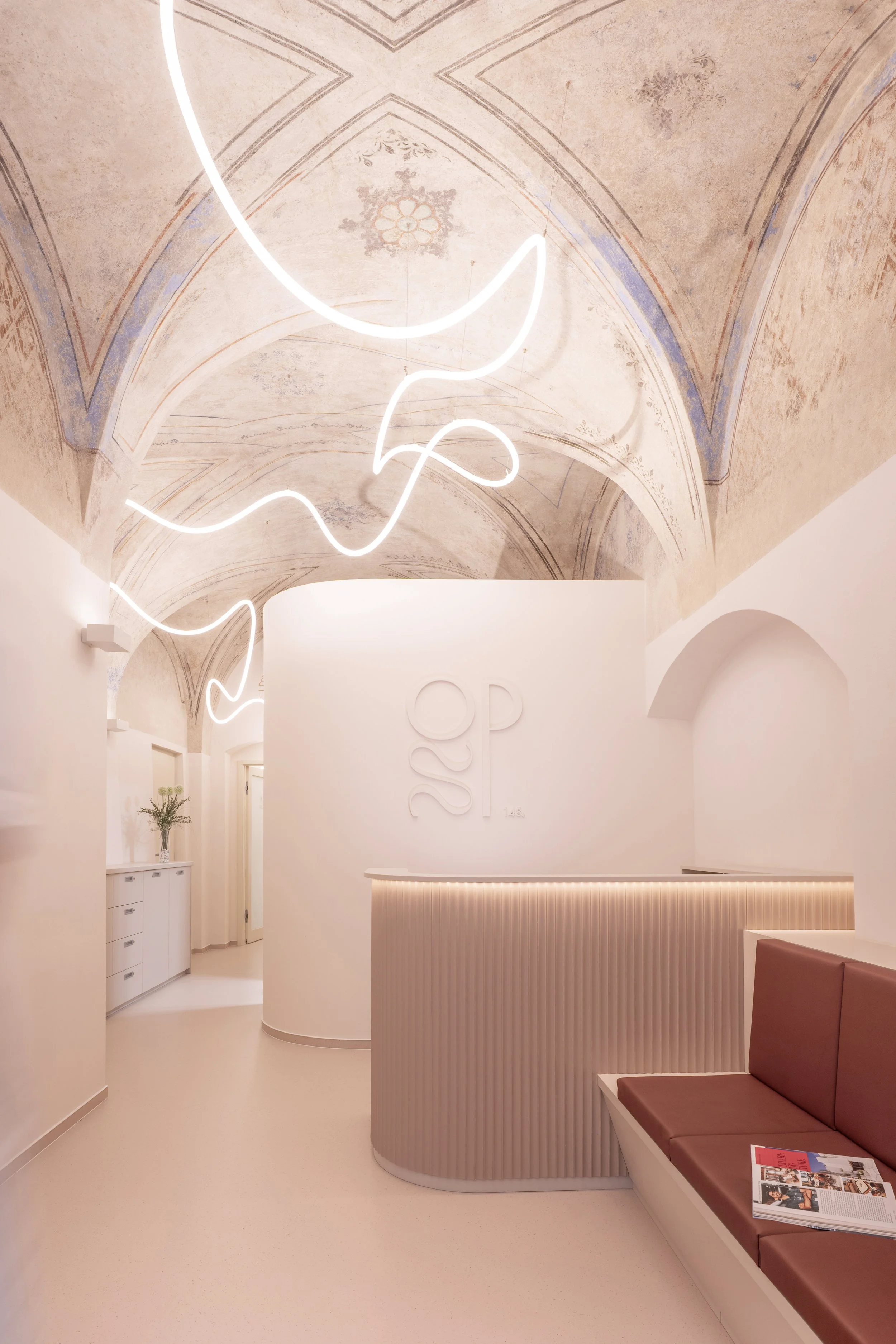 Ordinace Pod Štítem 's reception area beneath a restored Renaissance vault; renovation of a cultural monument in Čáslav