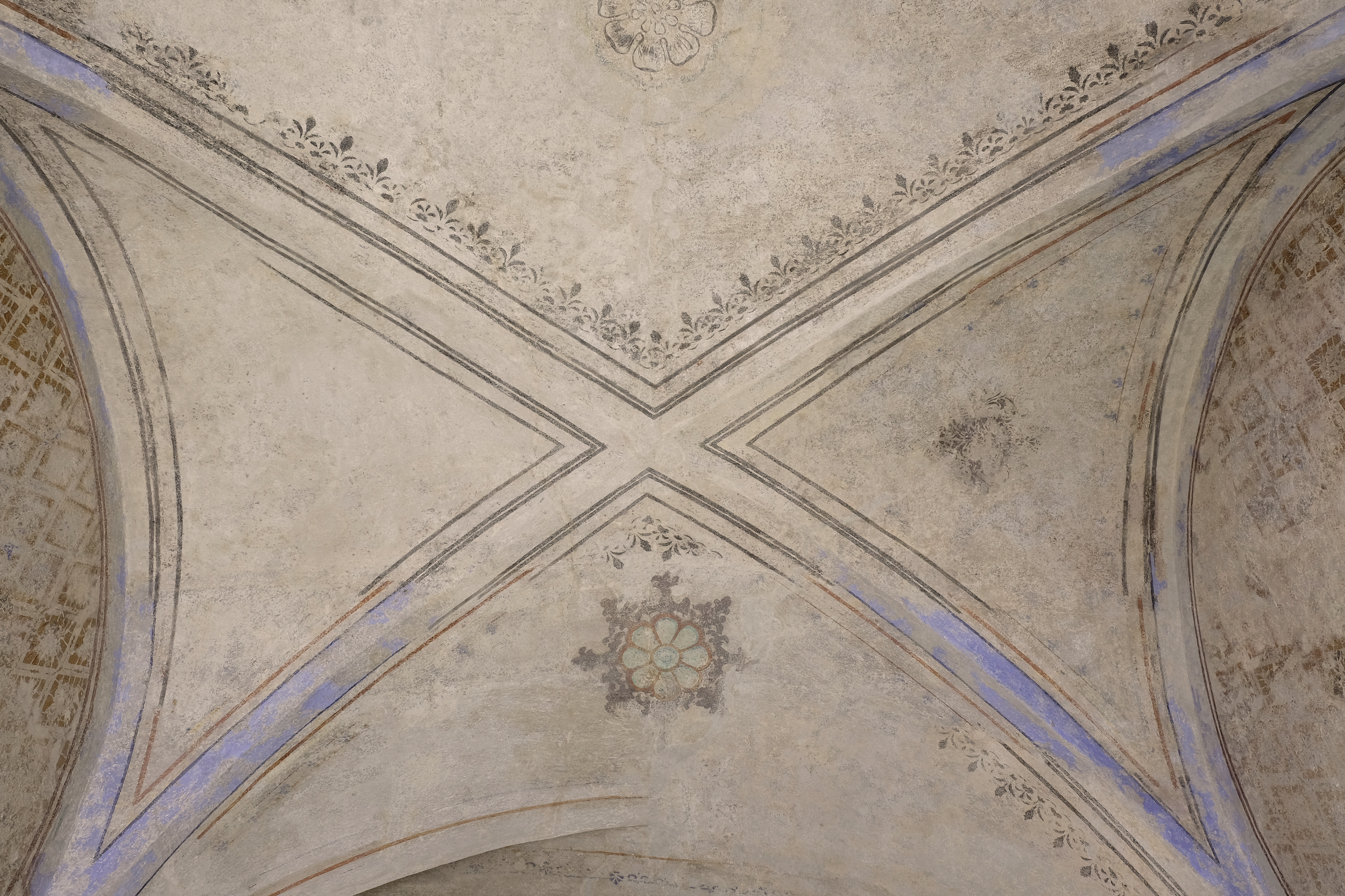 A cross vault with 19th-century stencil paintings, following restoration retouching