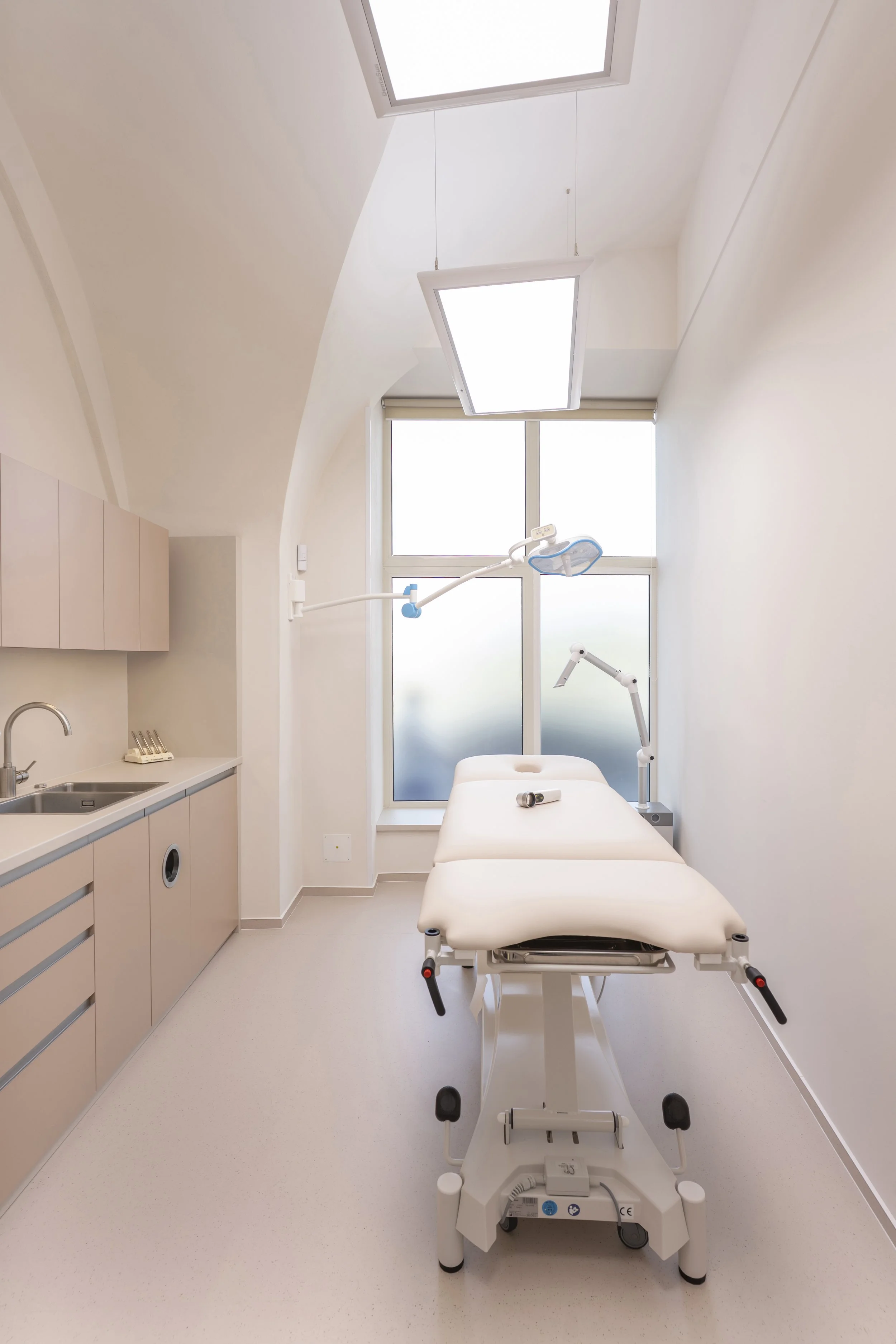A Former Pharmacy After Renovation: A Medical Office with Natural Light and a Treatment Chair