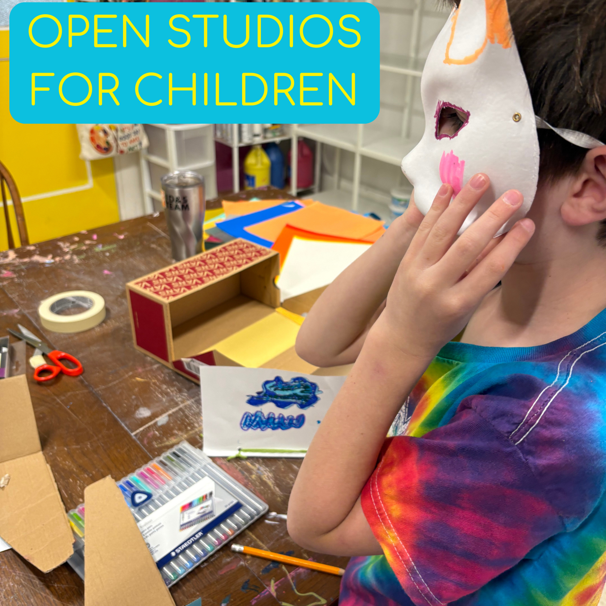 Children engaging in a multimedia art activity, using brushes and paint to create on paper, with various cups of paint and art supplies on the table.