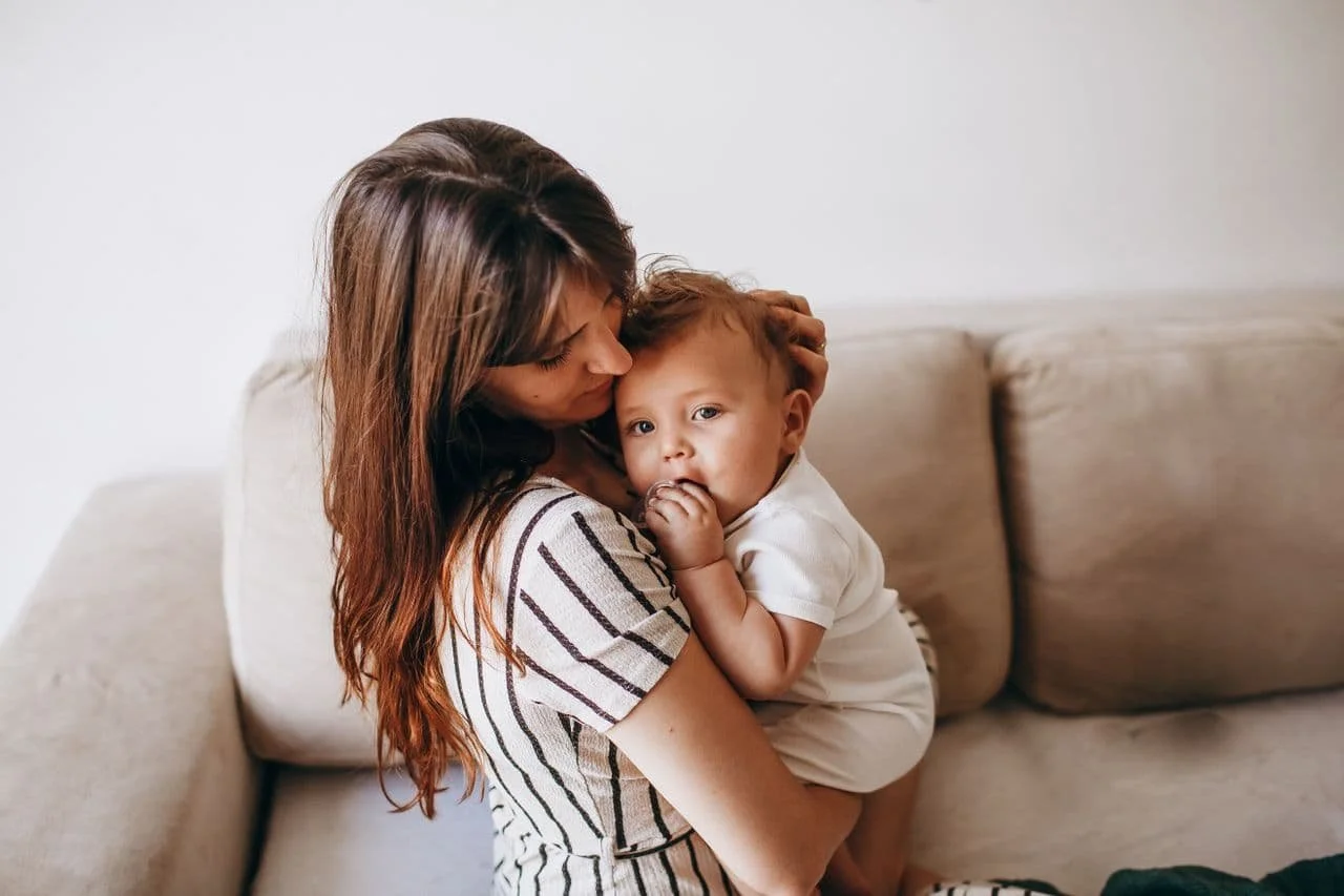 mother-with-baby-on-sofa