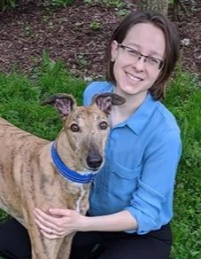Dr. Kelsey Weeg posing with her dog