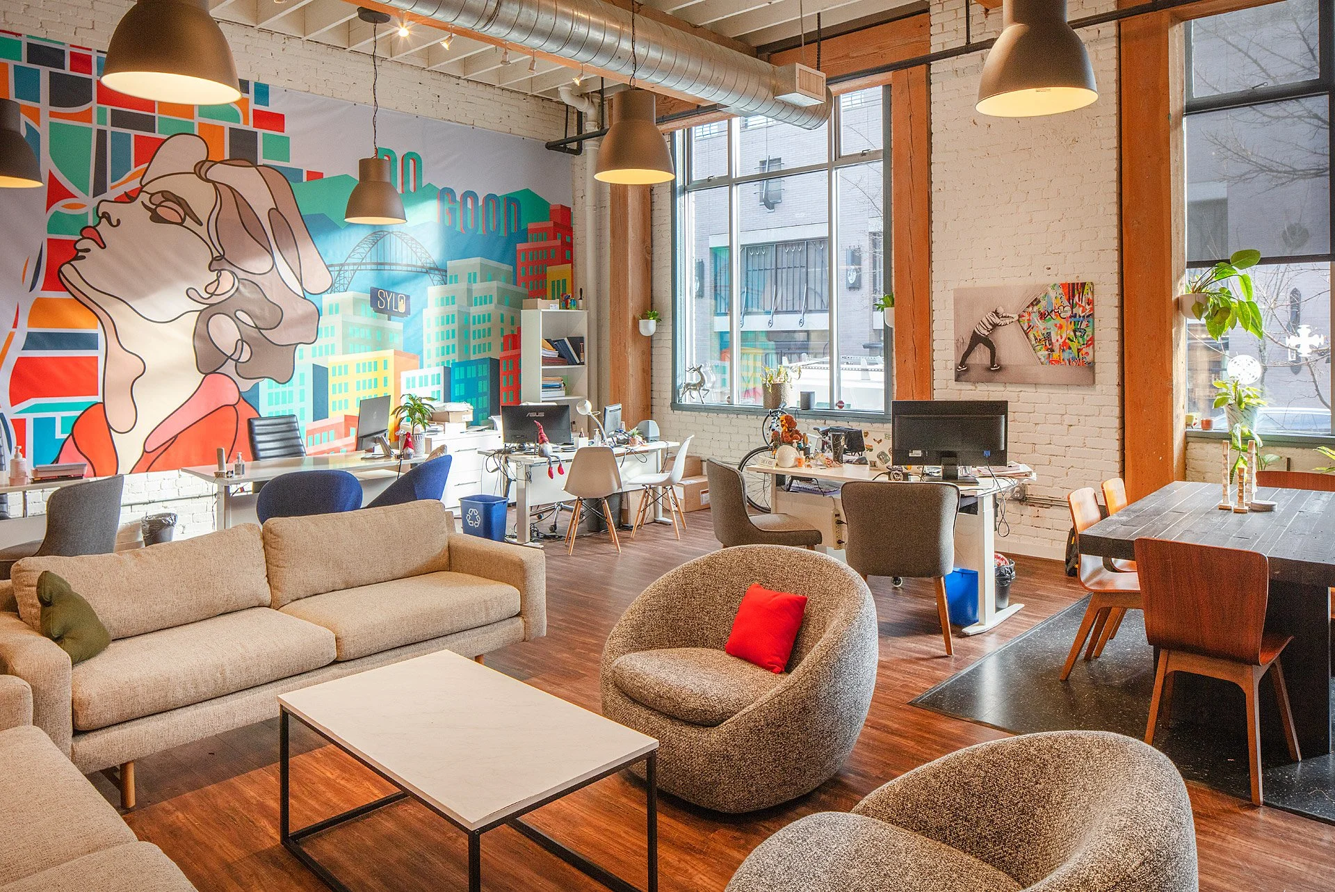 Office space with an abstract wall mural in The Dehen Building in Portland, Oregon
