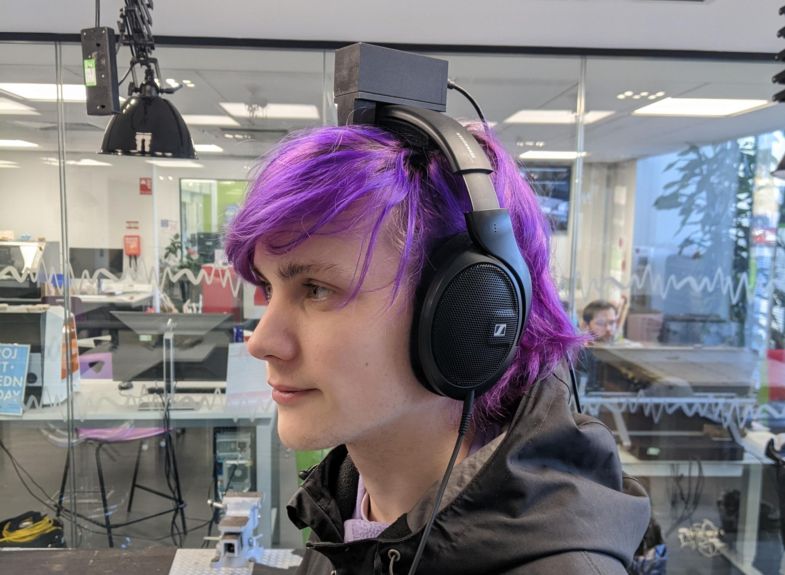 Playtester equipped with the custom game controller that has been hooked to their headset