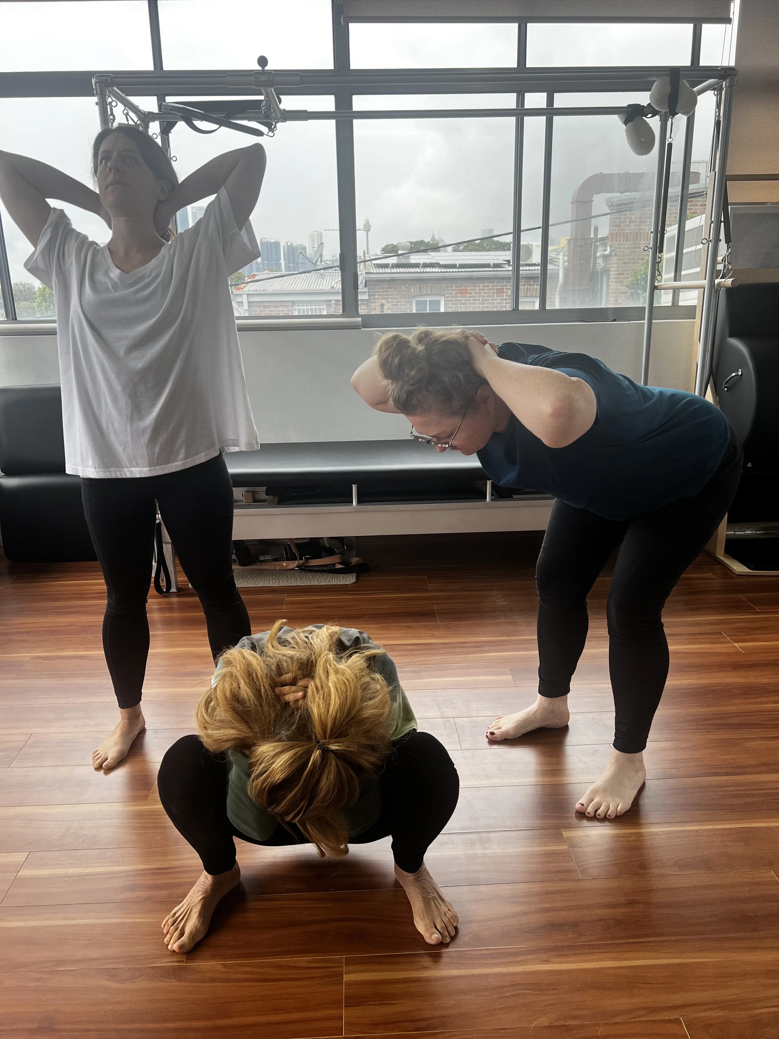 A group participating in a guided Fascial Maneuvers class in Sydney, exploring gentle movement, breathing and body awareness.