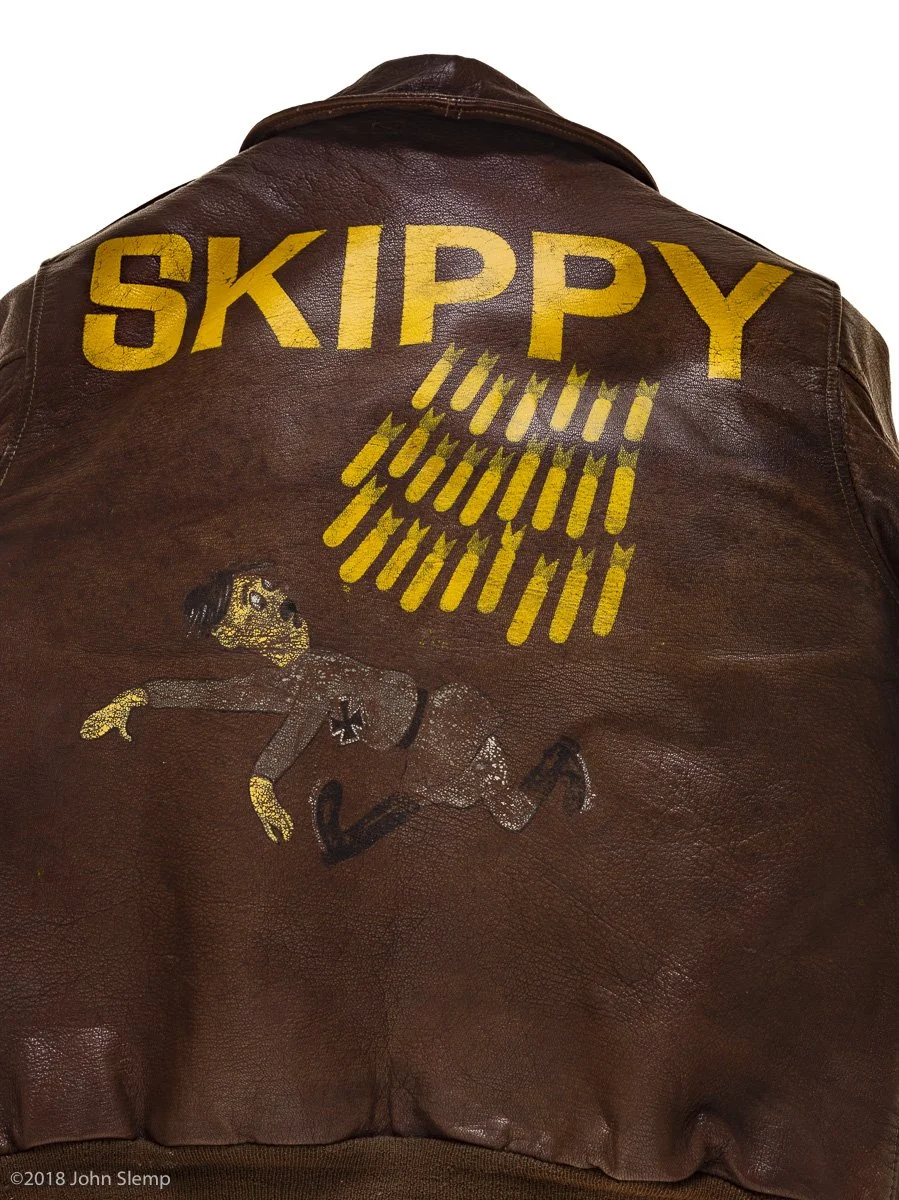 This jacket belonged to Joseph F. Doyle, a navigator attached to the 570th squadron of the 390th Bomb Group.  “Skippy” and her crew flew 30 missions before crashing on their 31st mission, a raid on an airfield in Villacoublay, France, on February 5, 
