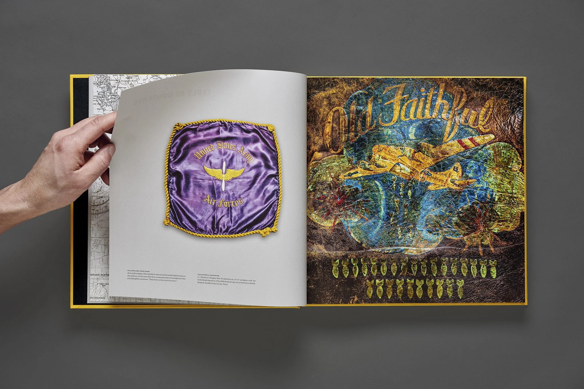 Opening spread of the book "Bomber Boys:  WWII Flight Jacket Art" featuring a WWII A-2 flight jacket with "Old Faithful" painted over a B-17 bomber, and a satin pillow collected by a crewman from one of his duty stations during the war.