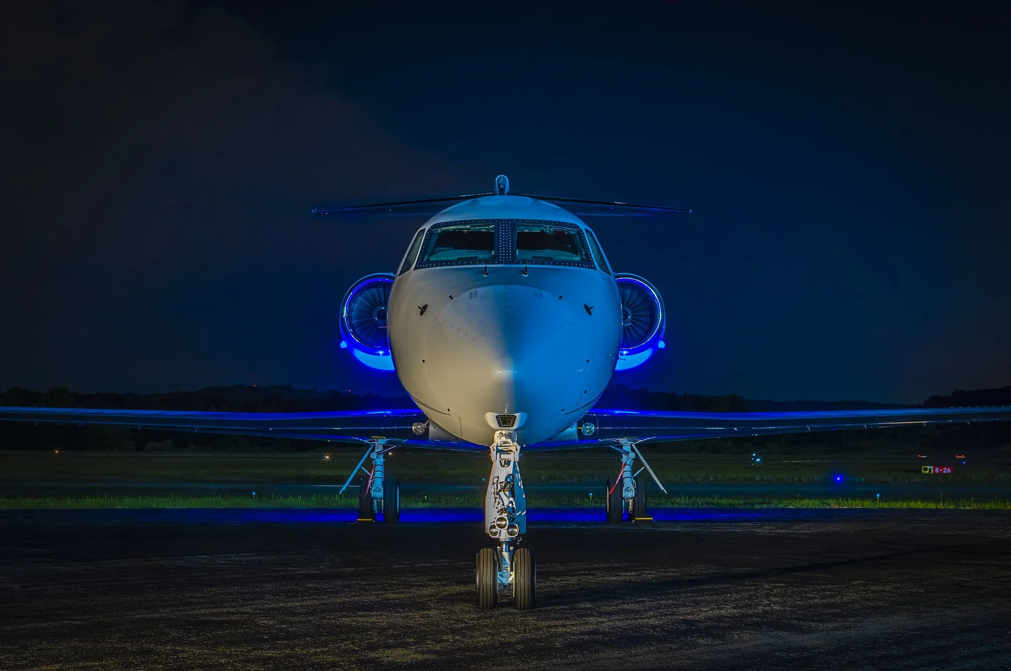A corporate jet illuminated in the pre-dawn hours at Atlanta's Fulton County Airport.  Created as advertising for Hill Aviation.