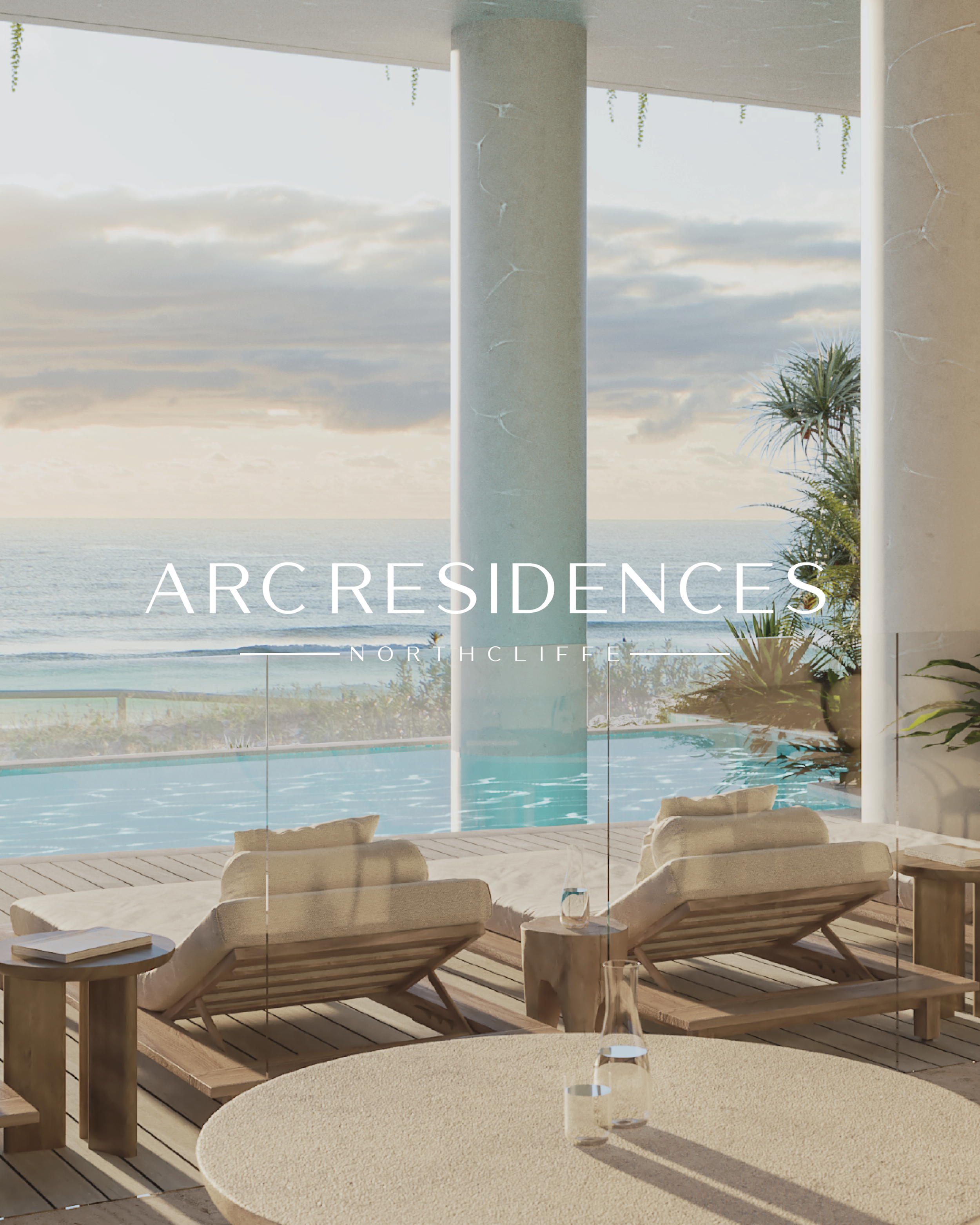 Luxurious seaside terrace featuring sun loungers, a wooden deck, glass railing, and a view of the ocean with cloudy sky. Text overlay reads 'ARC RESIDENCES NORTHCLIFFE.'