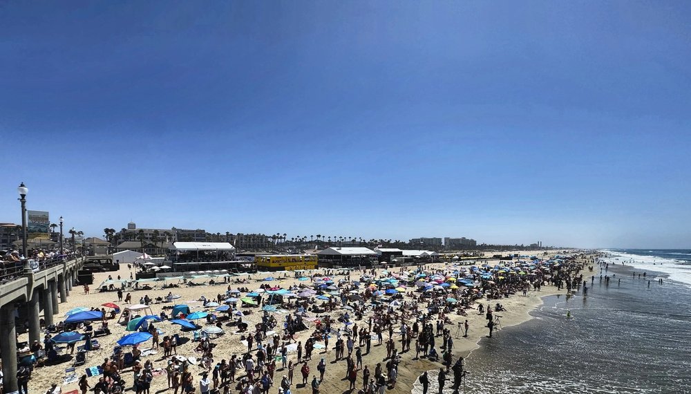 Competition site and spectator crowd on the sand at the US Open of Surfing, Huntington Beach