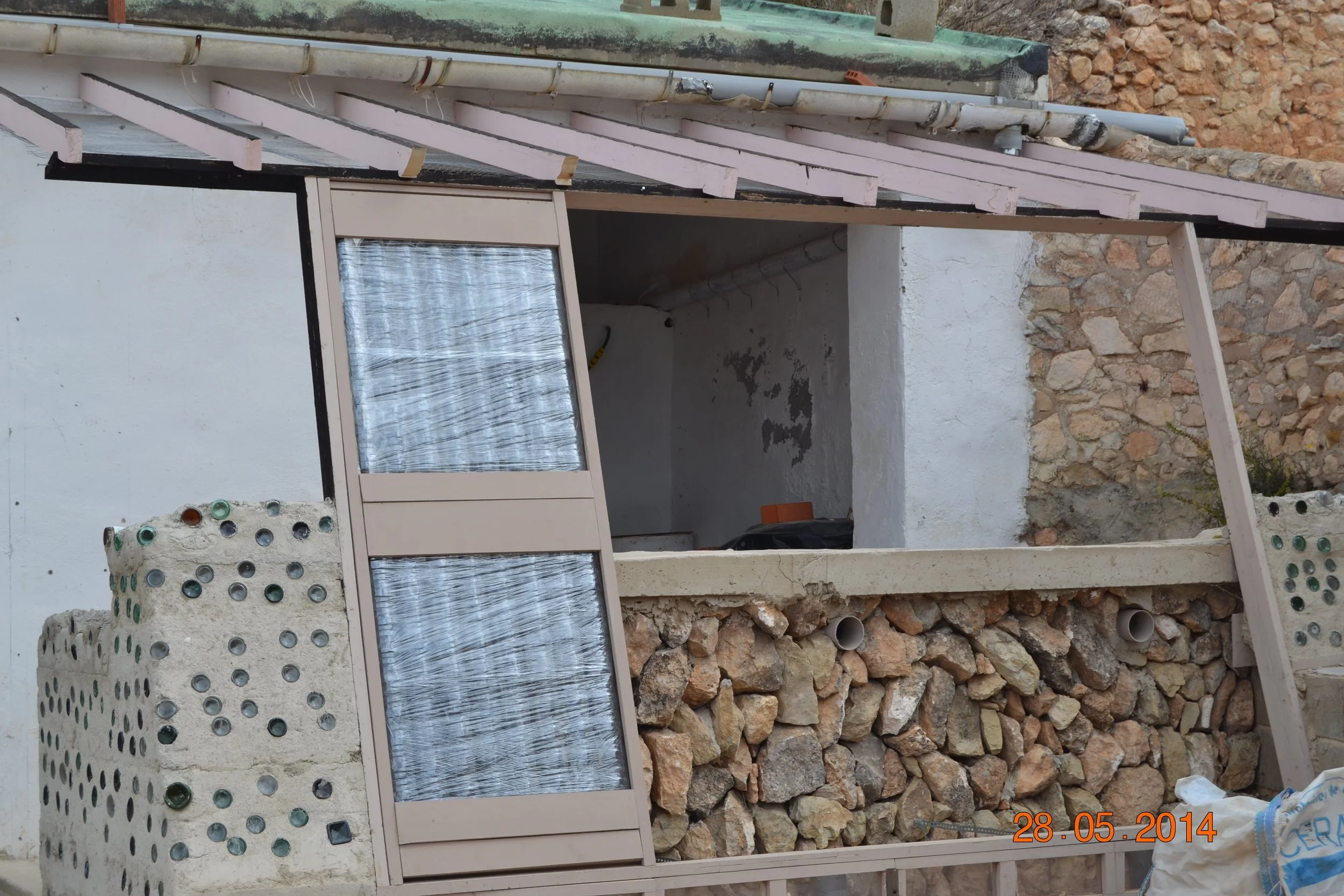 The Earthship greenhouse under construction