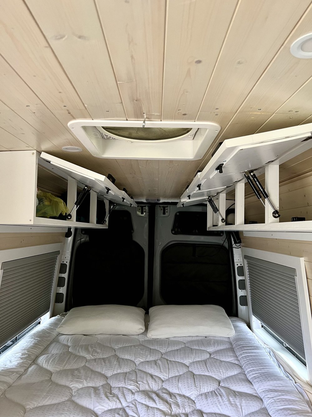  Upper cabinets in back of van camper 