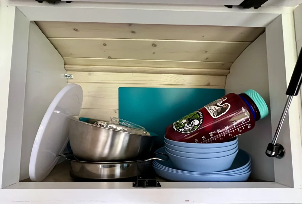  Upper cabinet used to store dishes in van camper 
