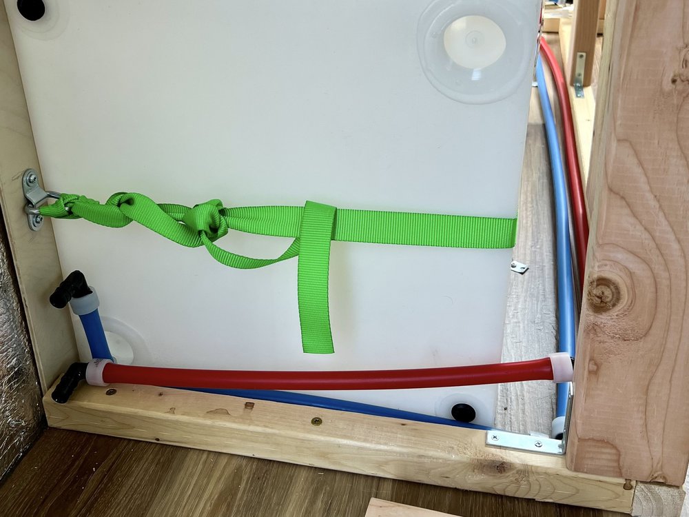 Pex-A water lines running in front of water tank