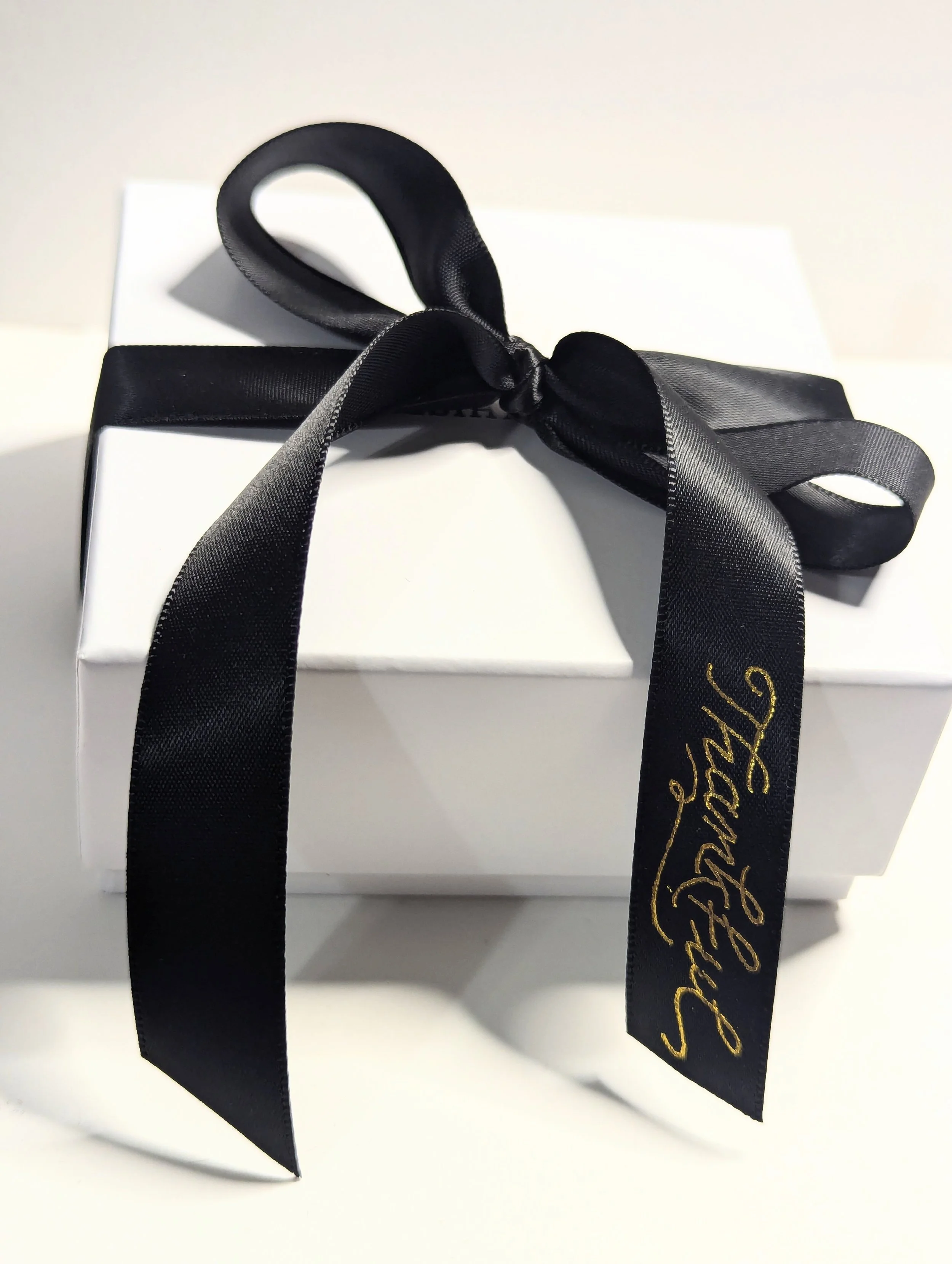 gold foil calligraphy on satin ribbon