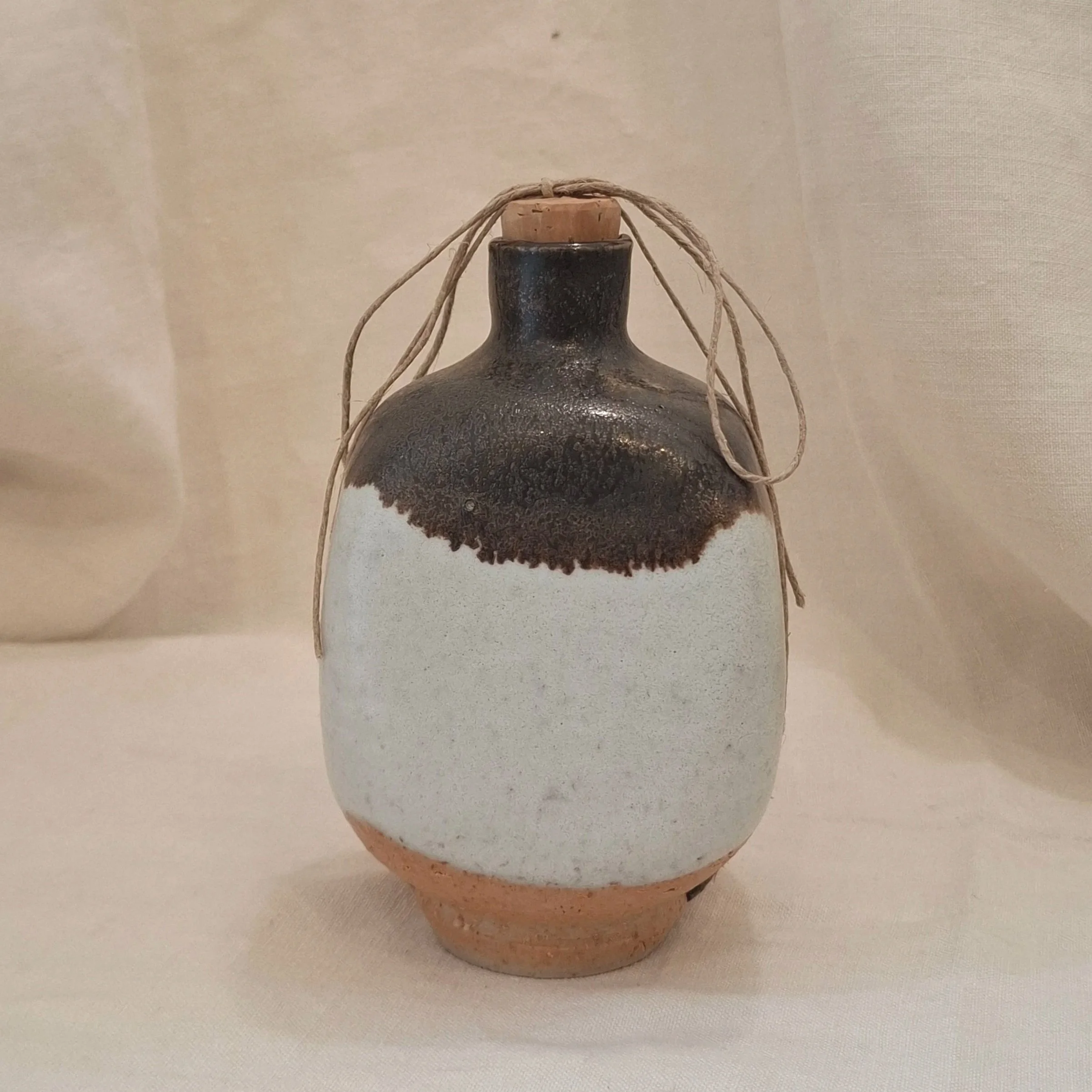 Grey, brown and yellow glazed stoneware bottle by Miguel Neto