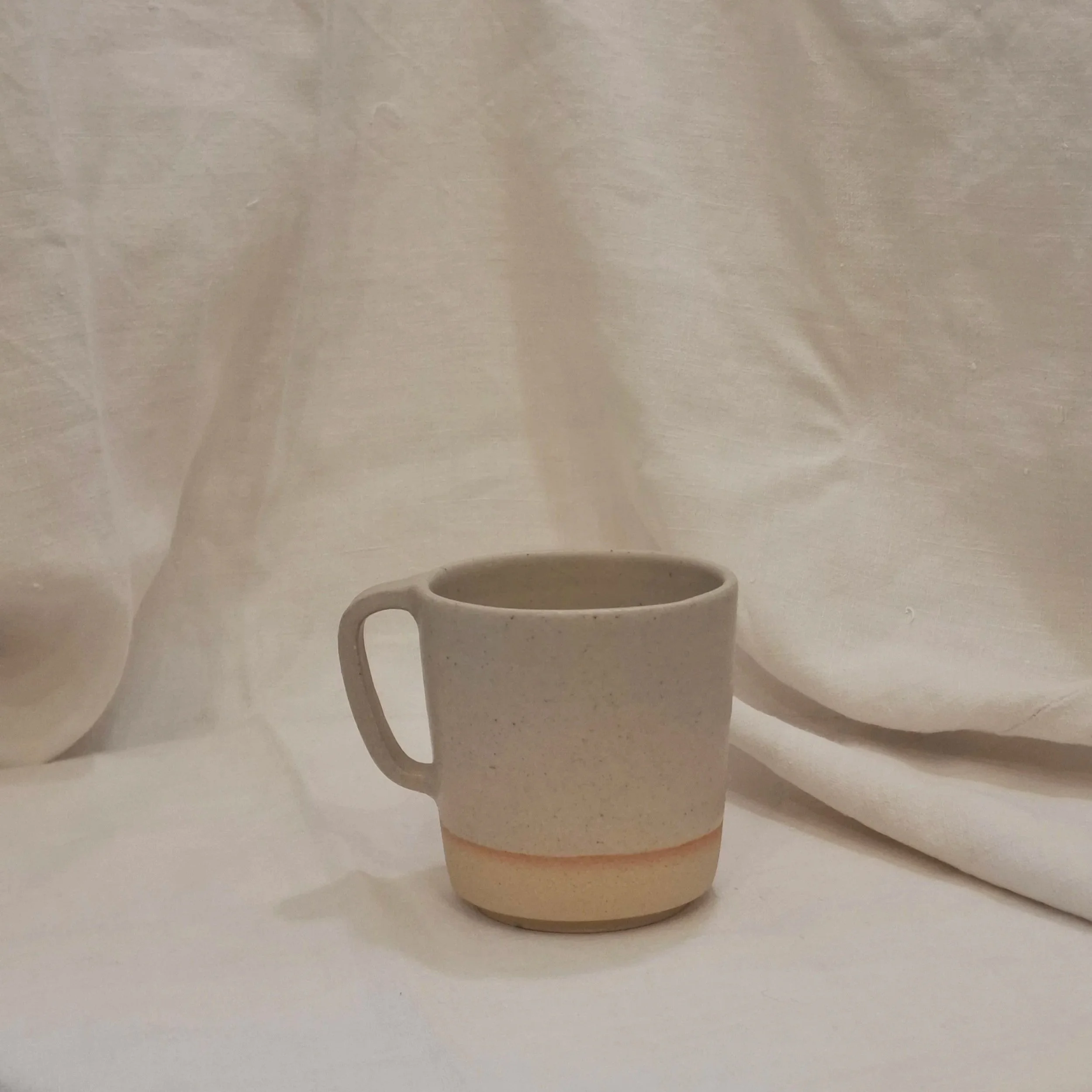 Sand stoneware mug by Rita Zorro