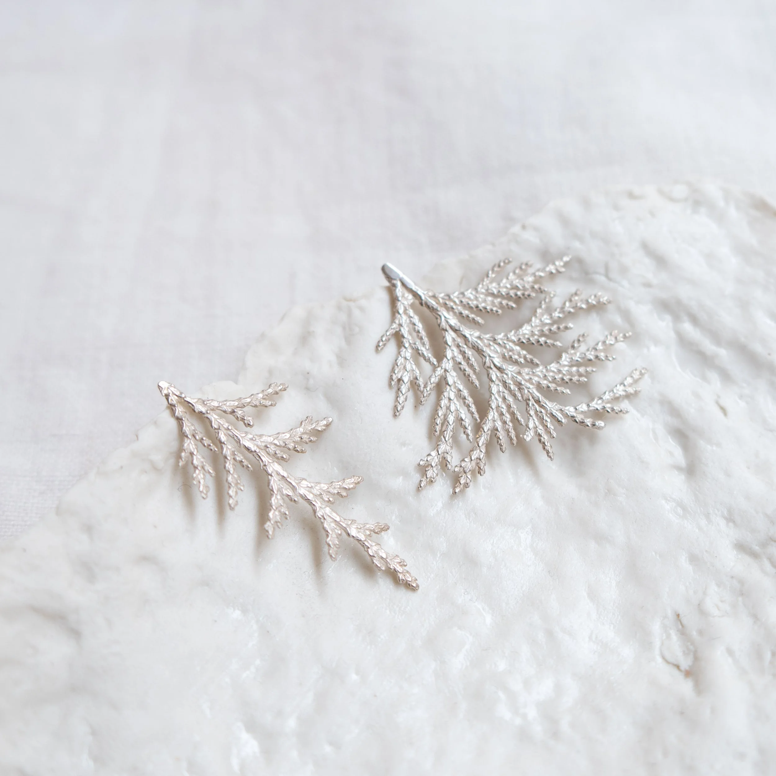 Sterling silver, irregular Cedar leaf earrings by Amuleto