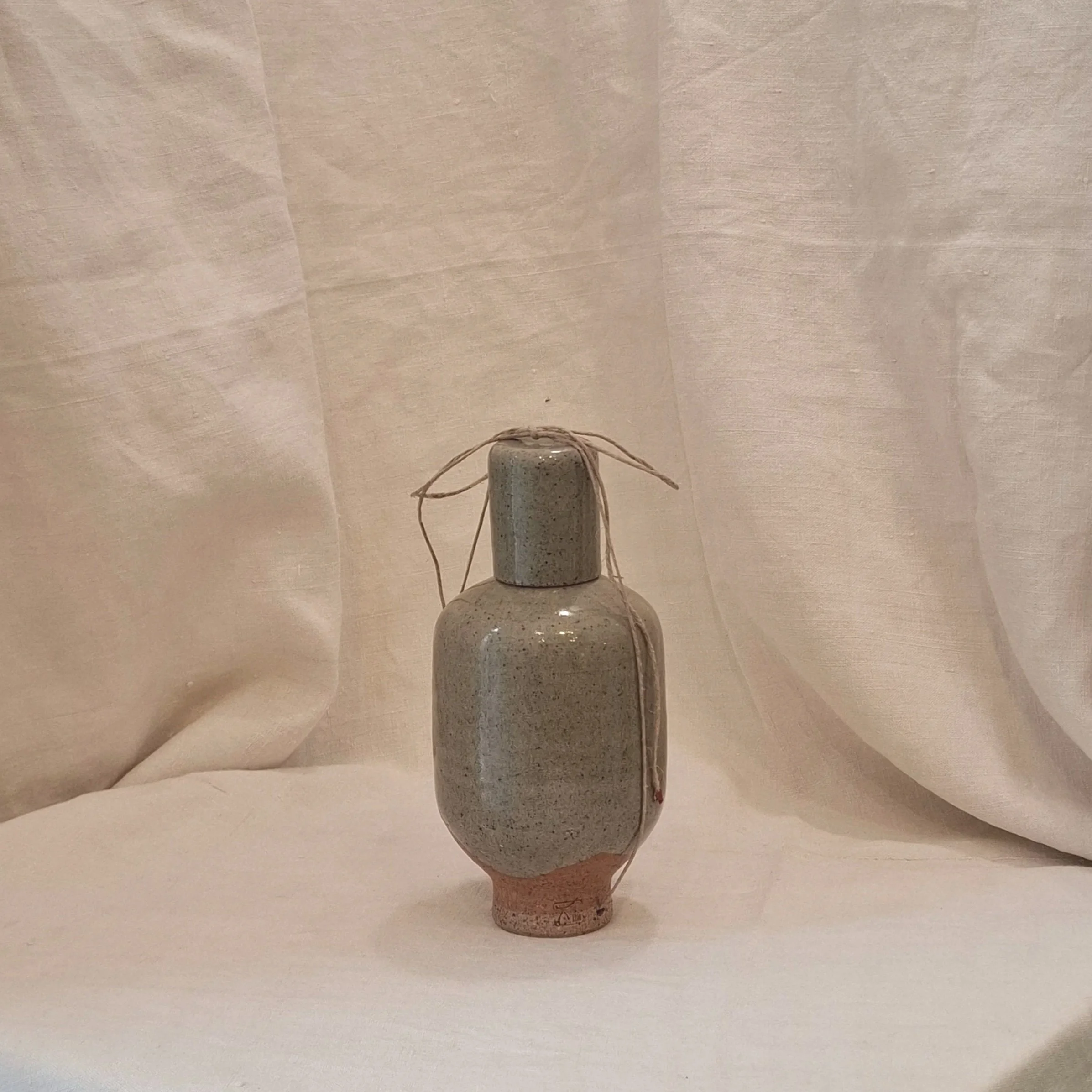 Green glazed stoneware bottle by Miguel Neto