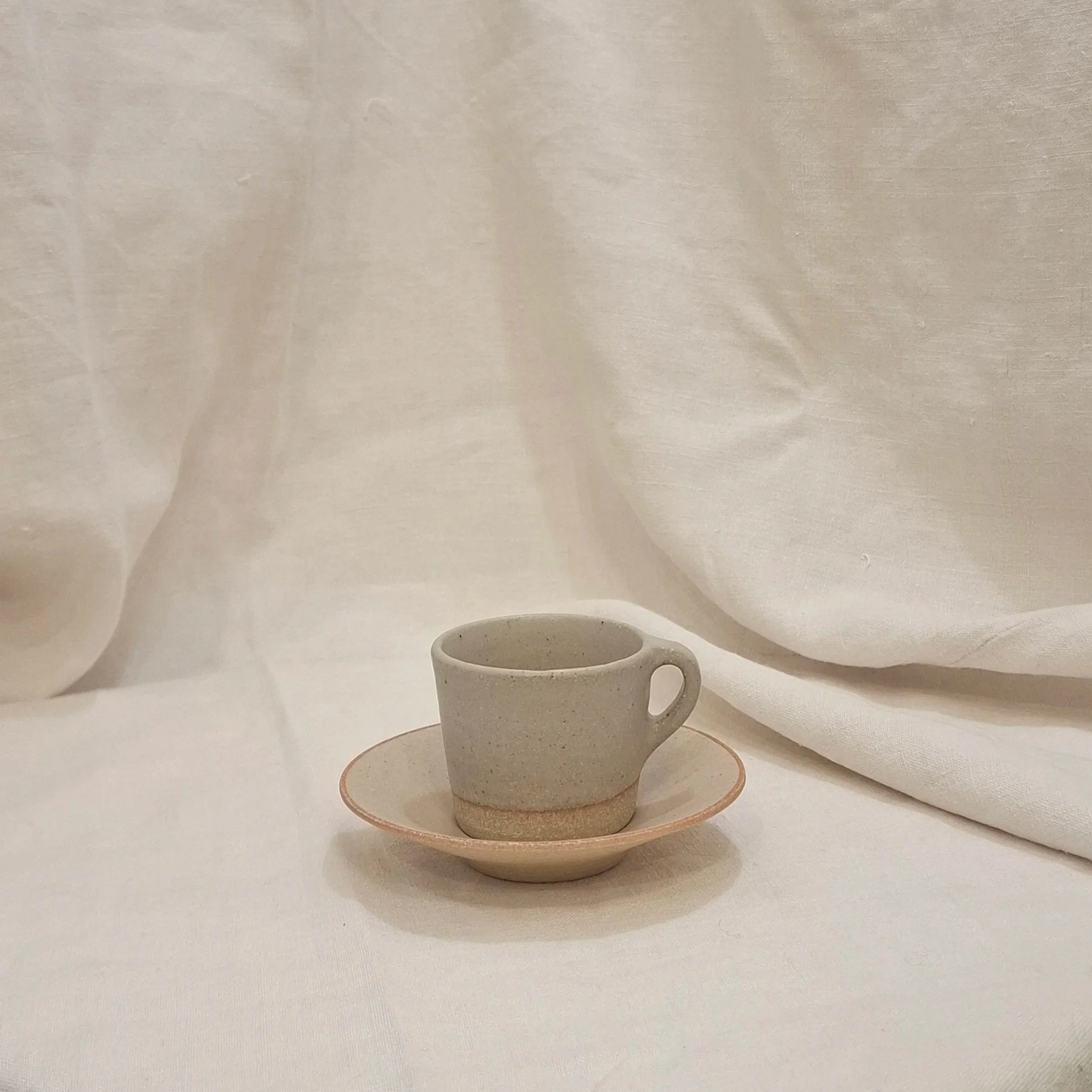 Sand stoneware coffee set by Rita Zorro