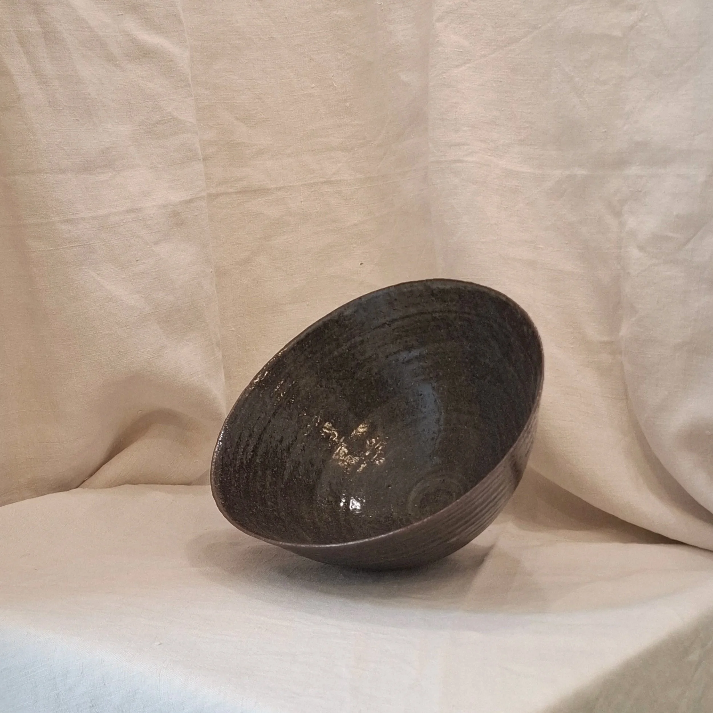 Dark brown glazed stoneware bowl by Miguel Neto