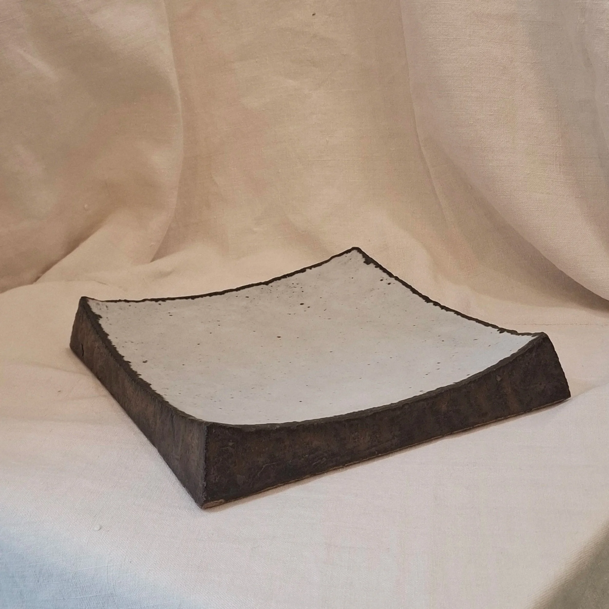 Copper and light grey glazed stoneware plate by Miguel Neto